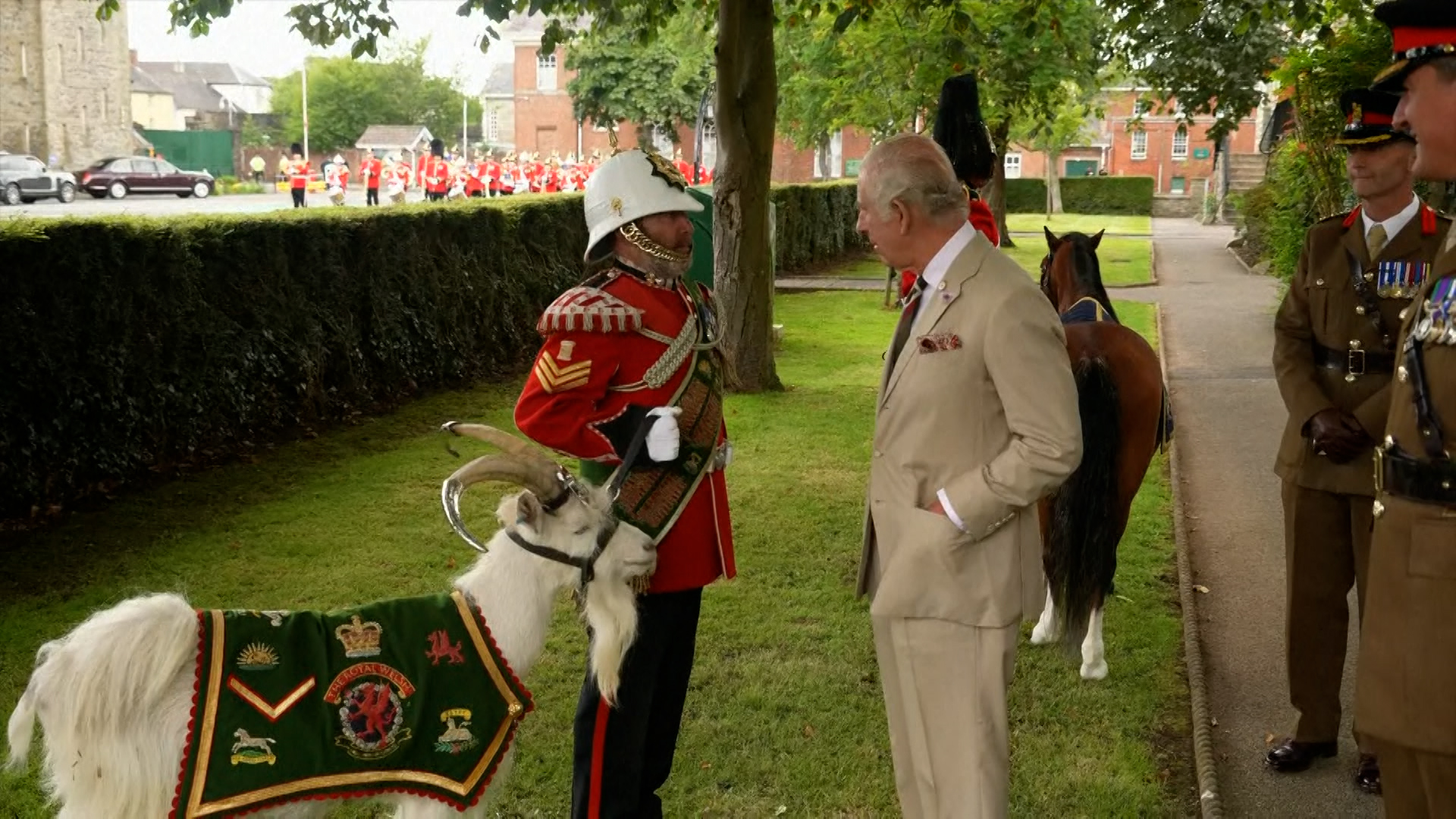 King meeting Welsh military mascot the Royal Welsh goat, Lance Corporal Shenkin IV at Brecon Barracks 