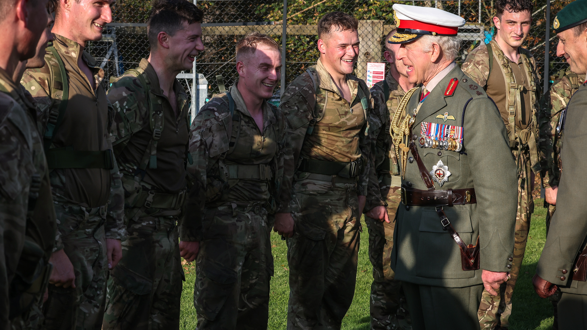 The King shares a laugh with recruits