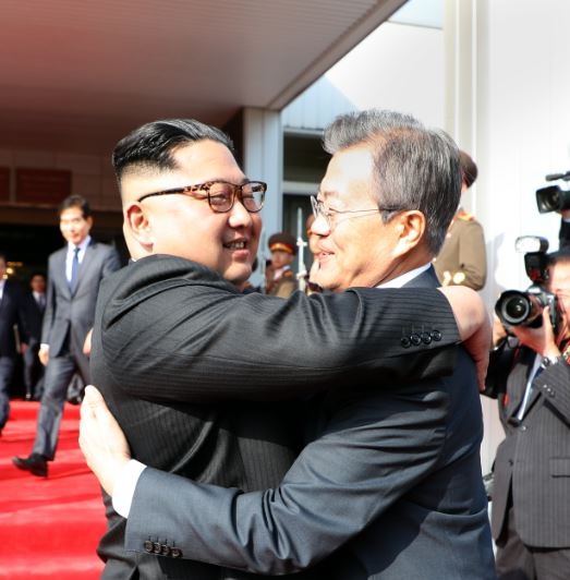The two Korean leaders embrace as they meet for a second time in a month (Picture: PA).