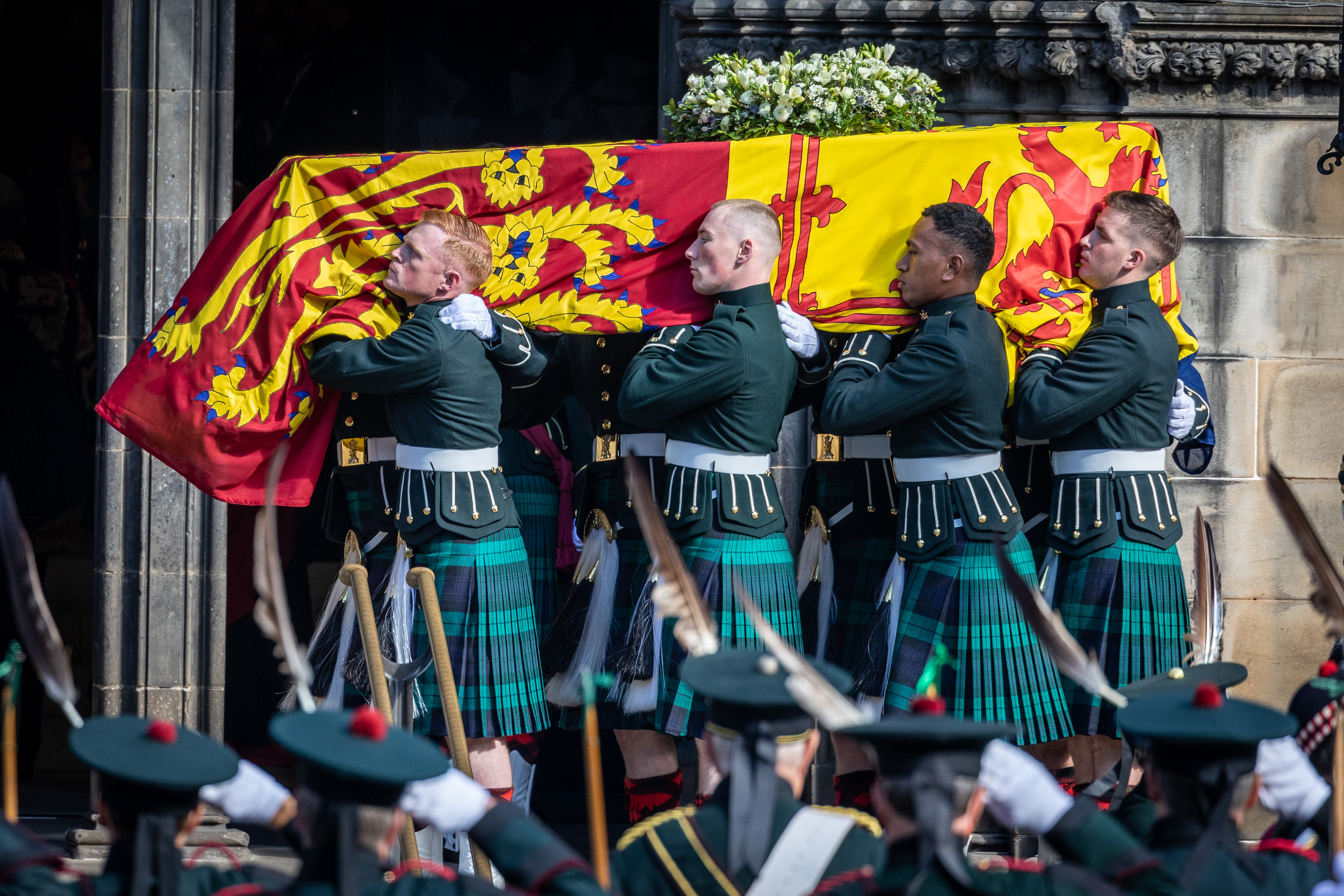 Her Majesty Queen Elizabeth II's coffin carried by members of the Royal Regiment of Scotland into St Giles' Cathedral