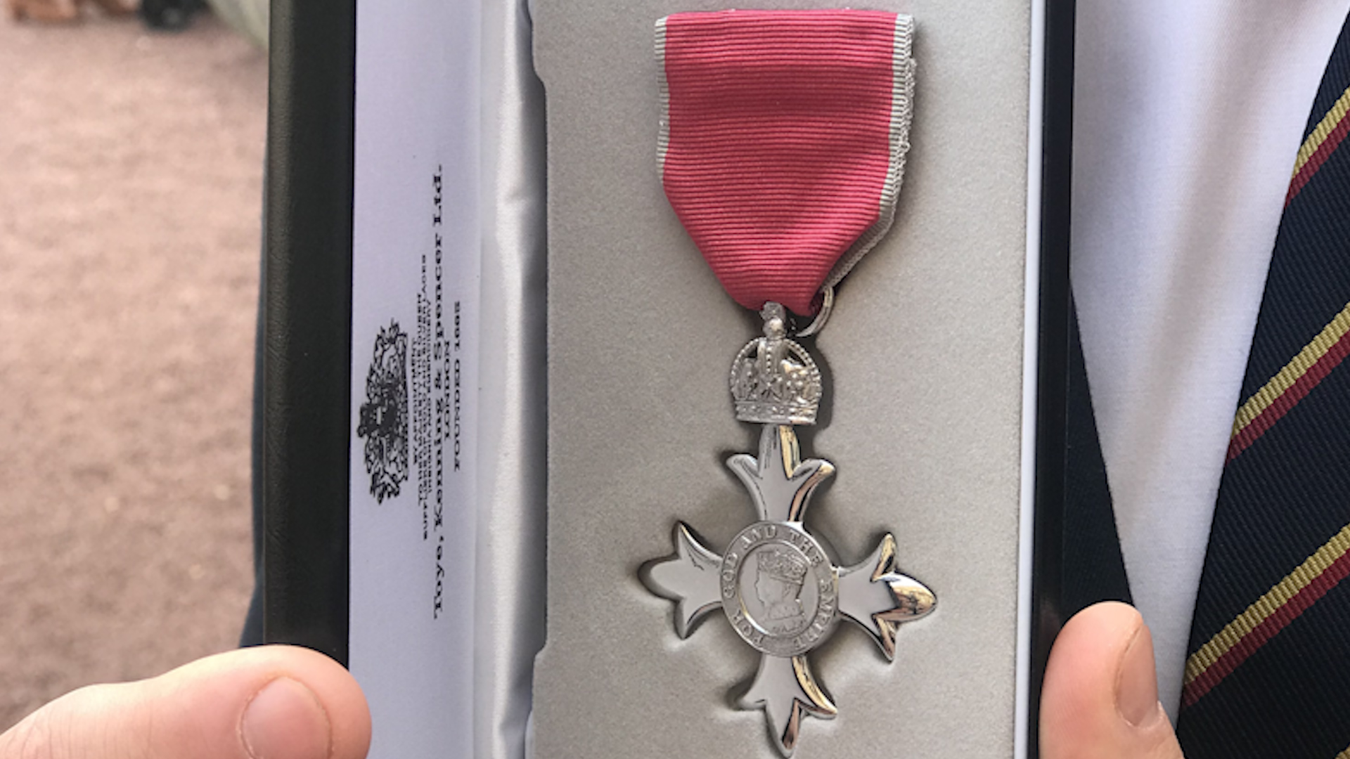 Lance Corporal Connor Roe shows off his MBE medal.