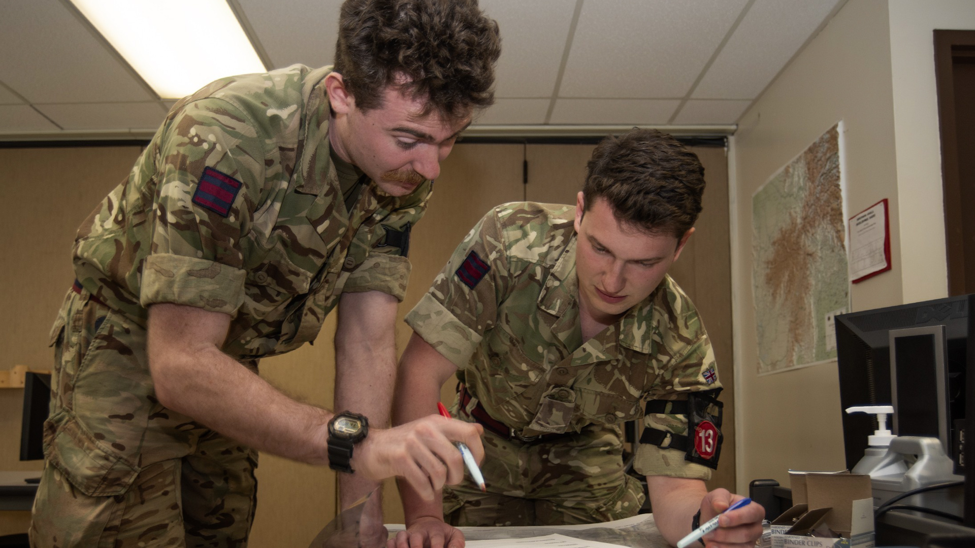 Sapper George Gibbons (left) and Lance Corporal Jonathan Ward map a safe convoy route as part of one of the timed tests (Picture: US Army)