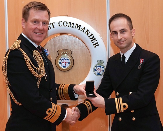 Vice Admiral Ben Key CBE presents Lieutenant Commander Ben Martin with the Queens Commendation for Valuable Service.