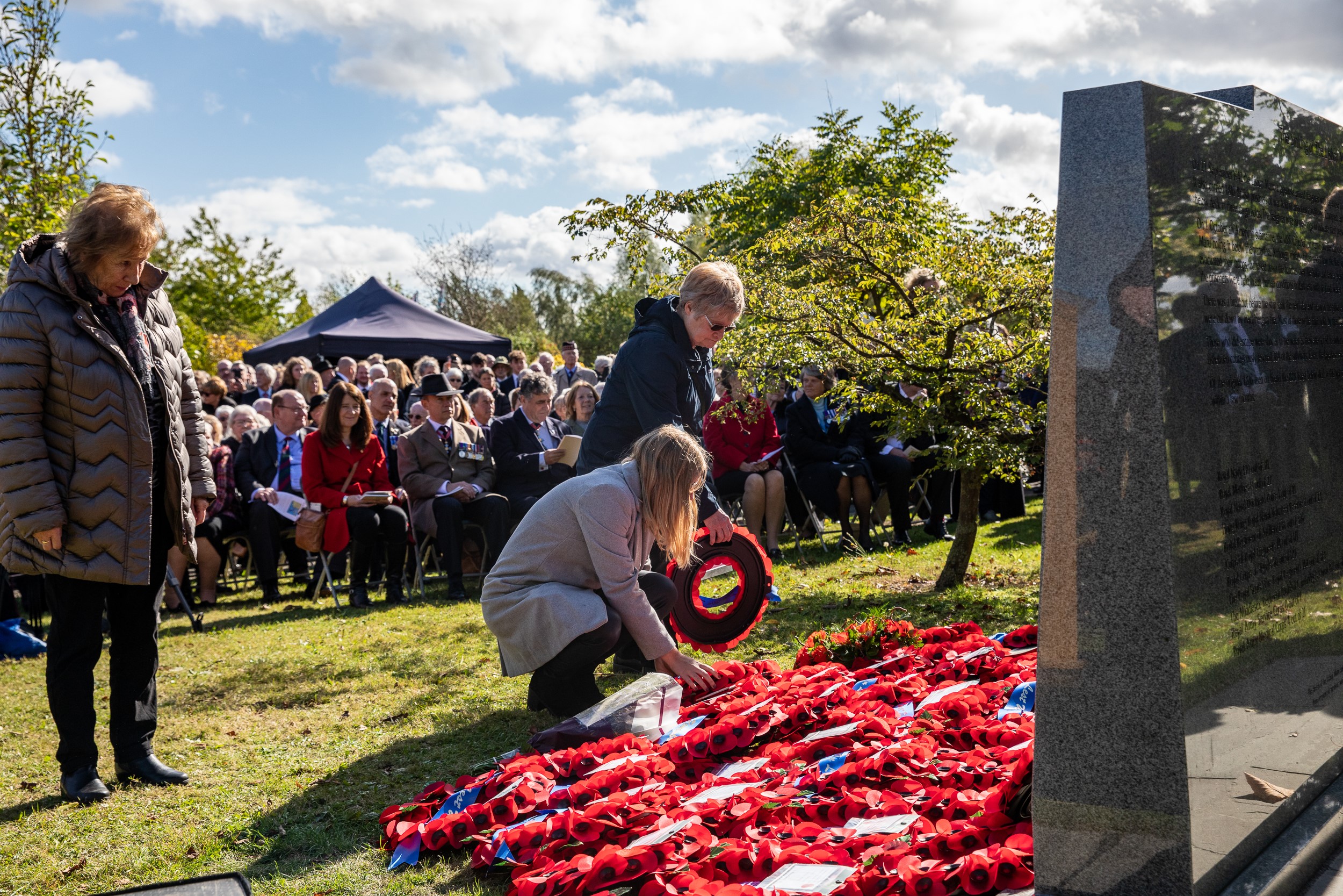 Families laying wreaths at Lisbon Maru memorial. Picture: Paul Armstrong.