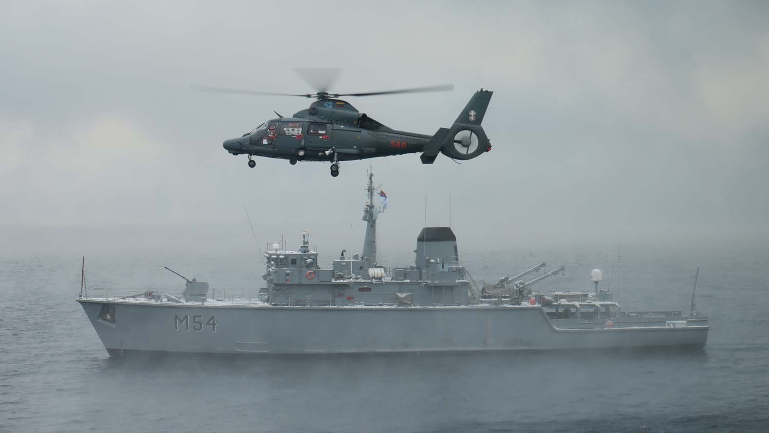 The ships were joined by Lithuanian Air Force search and rescue helicopter 42, a Eurocopter AS365 Dauphin aircraft (Picture: Lithuanian Navy)..