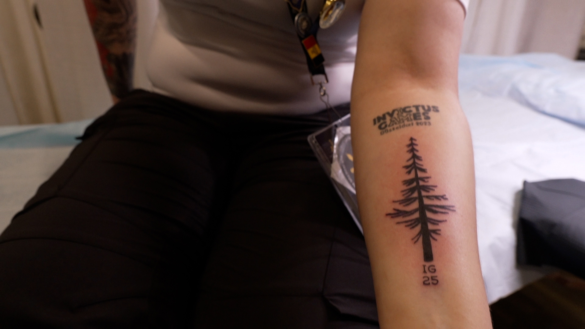 Liz shows off the completed tattoo - a lifelong reminder of her achievement