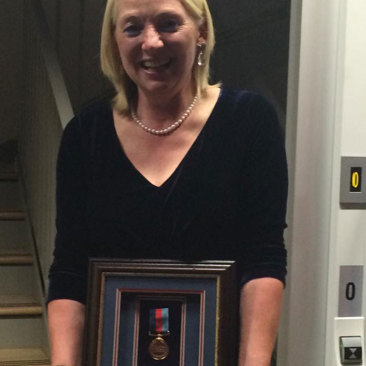 Louise proudly holding her Help For Heroes medal CREDIT Louise Bennet
