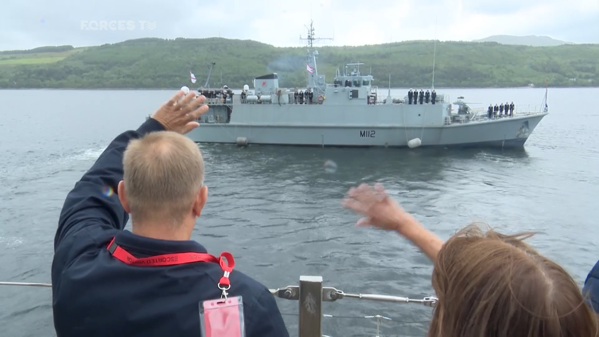 Loved ones wave goodbye to sailors on board HMS Shoreham.