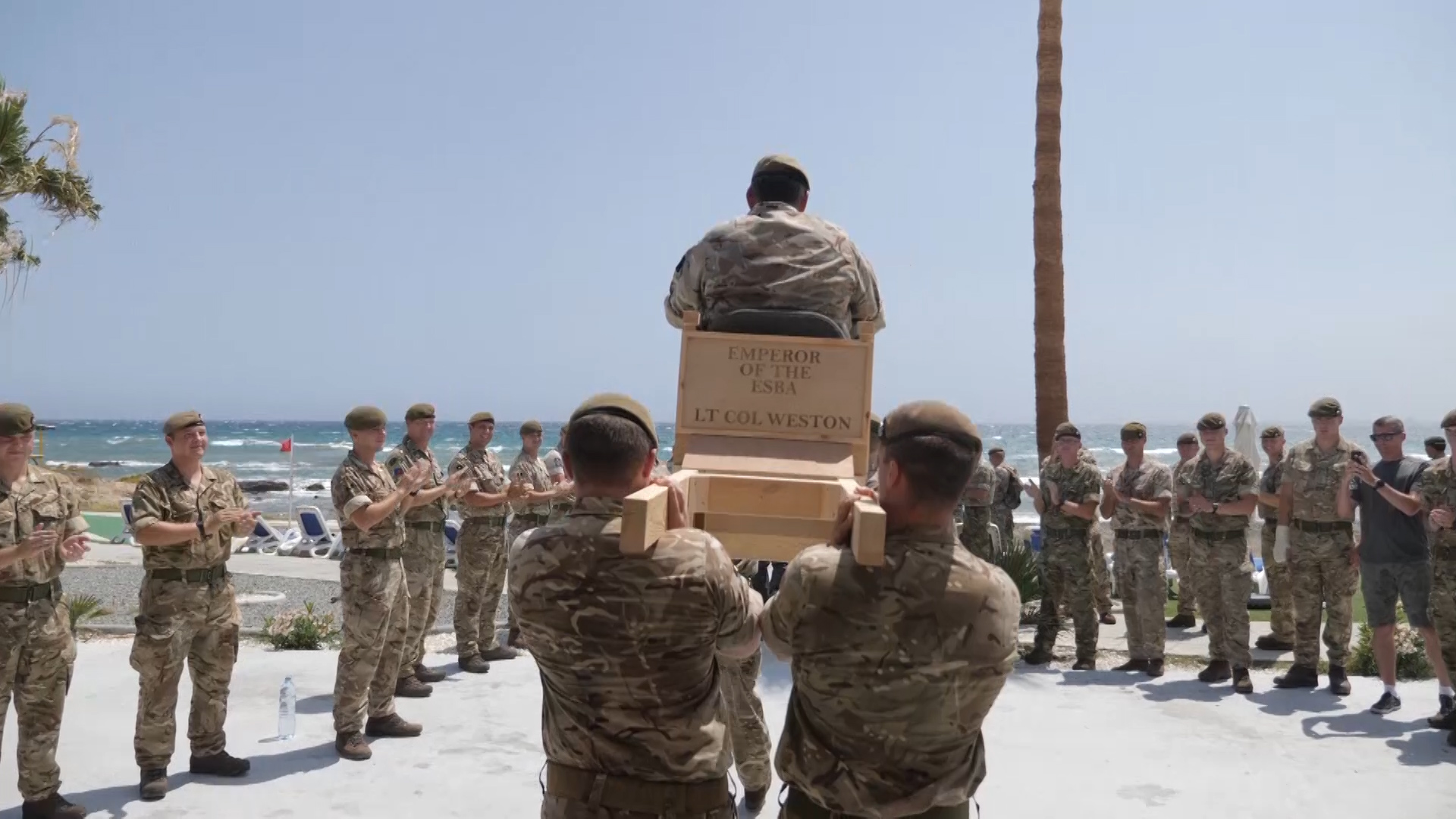 Lt Col Bruce Weston, Commanding Officer, 2nd Battalion The Royal Anglian Regiment carried to boat at Alexander Barracks