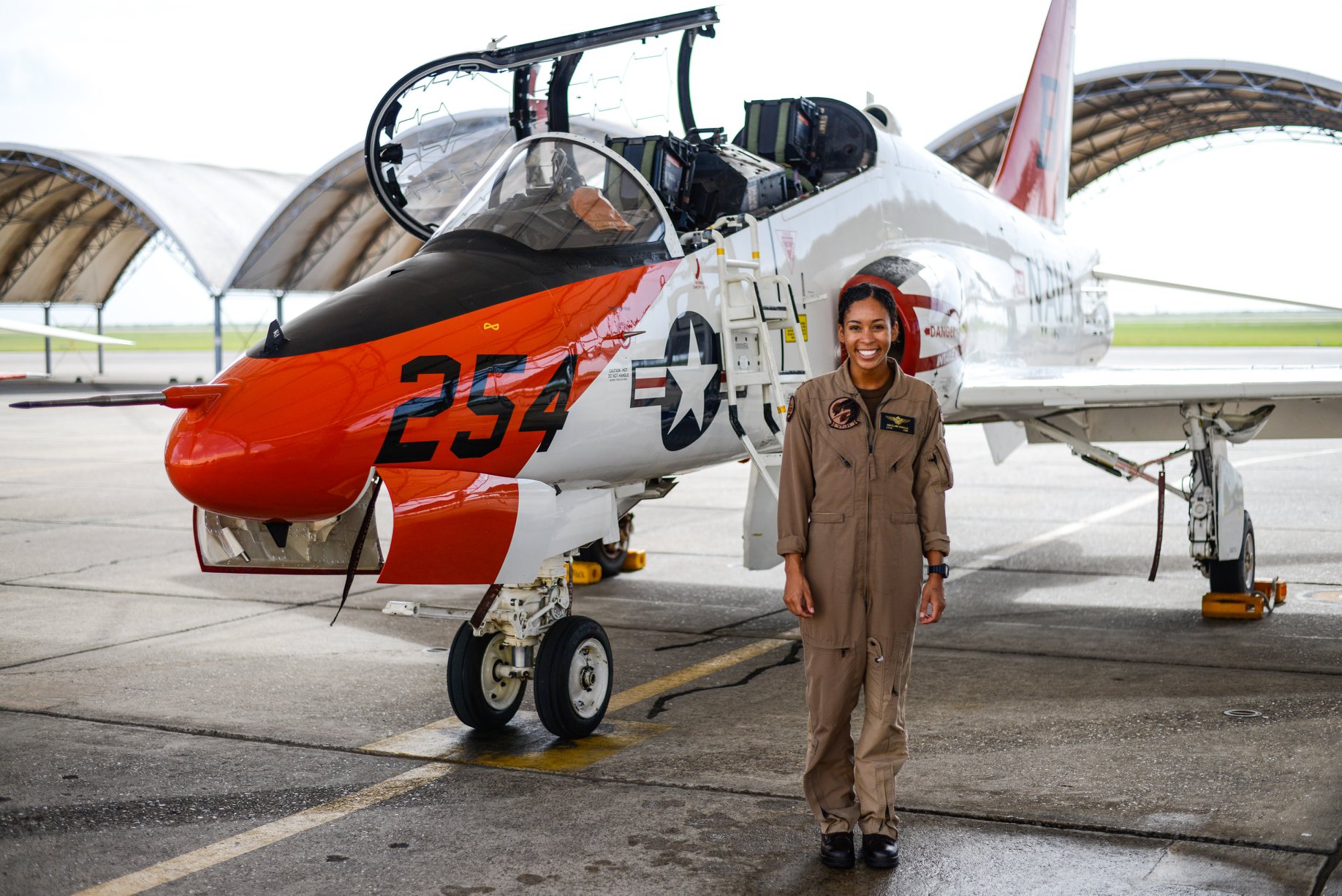 Madeline Swegle 1st known black female TACAIR pilot in US Navy stood next to T-45 Goshawk jet 090720 CREDIT CHIEF OF NAVAL AIR TRAINING (CNATRA) Facebook.jpg