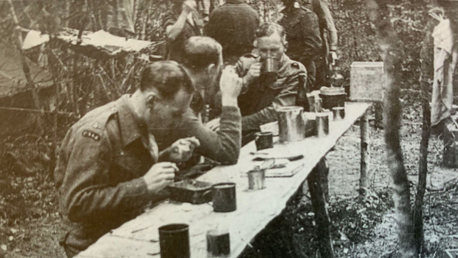 Maj Harry Poat, Lt Col Paddy Mayne and Padre McLuskey pictured eating in Morvan in 1944 CREDIT Davis family