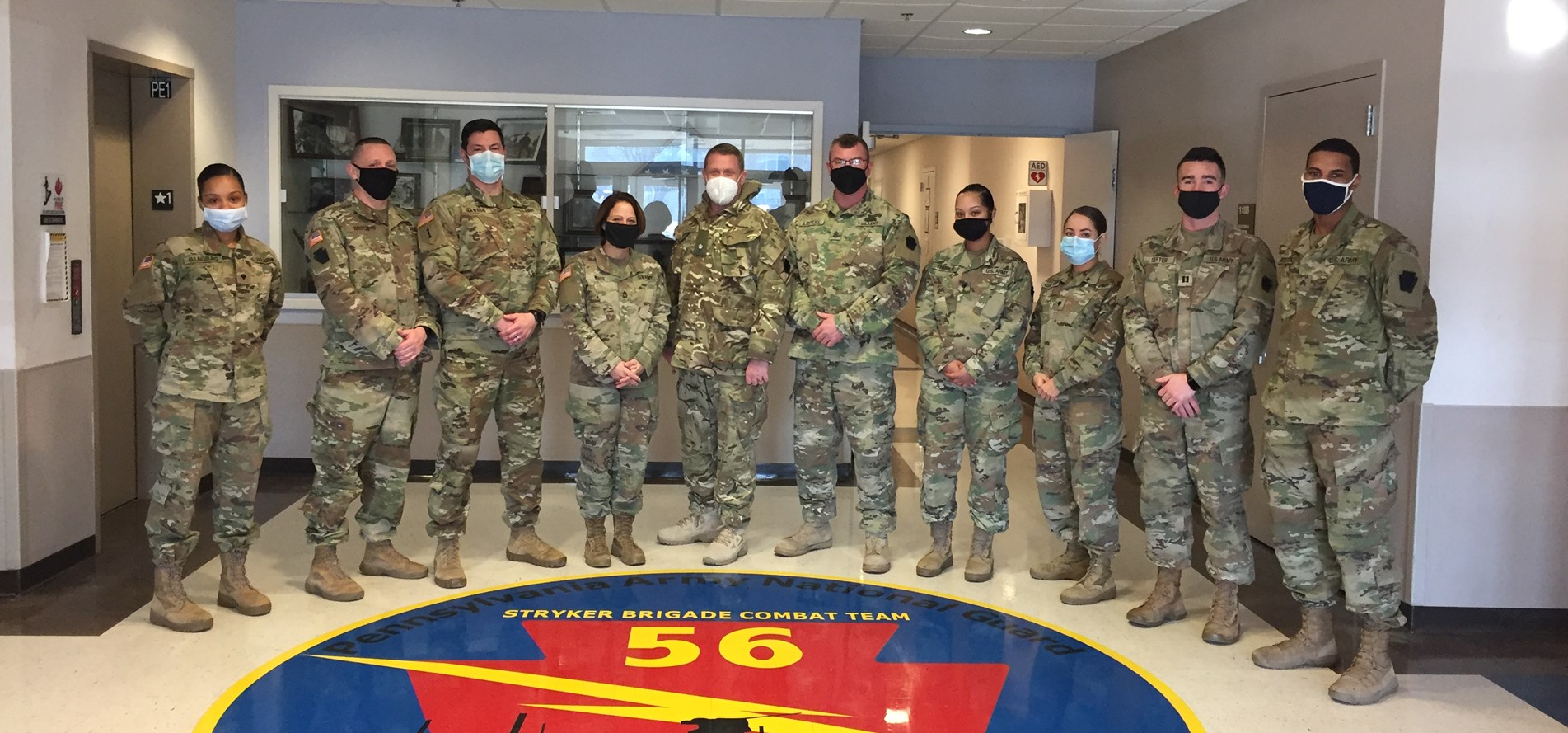 Major Francis (white mask), with personnel from the 56 Stryker Brigade Combat Team, US 28th Infantry Division (Picture: MOD).