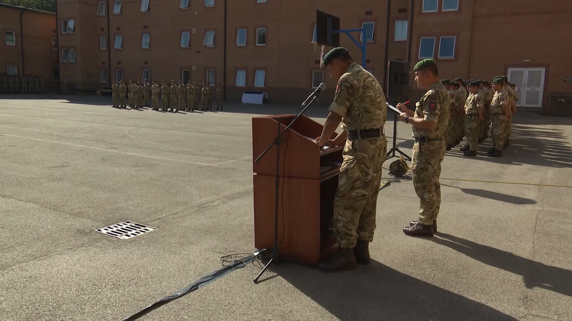 Major Rajesh Gurung reads out the names of the Gurkha recruits for cap badging.