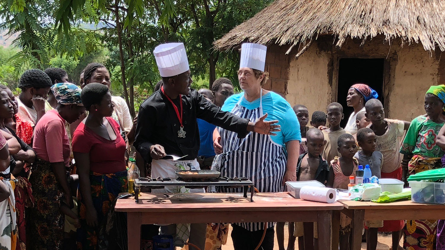 Malawian home cooks and local Head Chef Cephus teaching Penny authentic local cuisine CREDIT Commander (Retired) Penny Melville-Brown