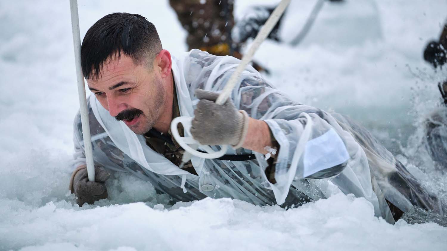 Royal Marine takes on ice breaking drills in Norway