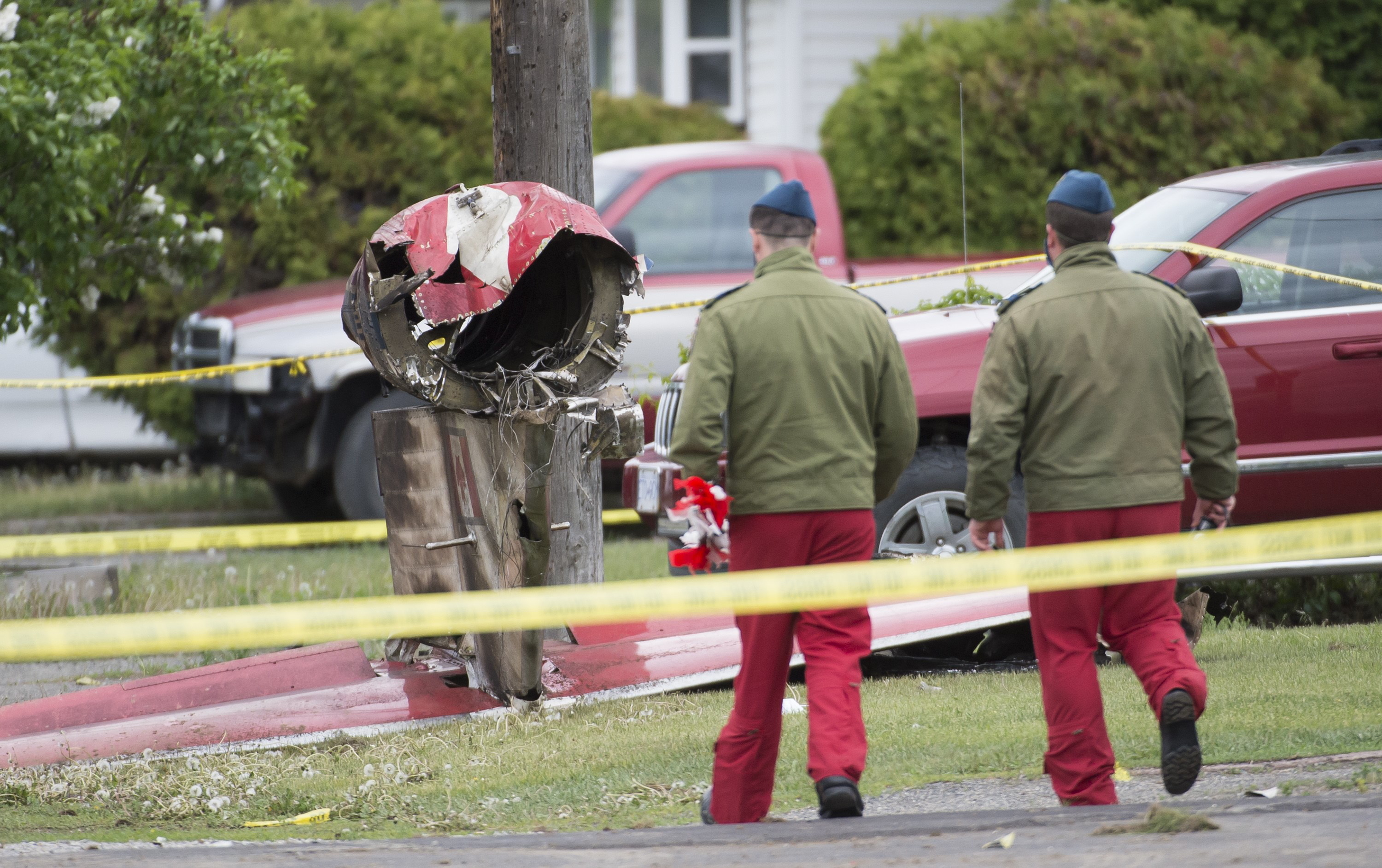 Cover image: Members of the Canadian Forces Snowbirds at the scene of the crash in Kamloops (Picture: PA). 