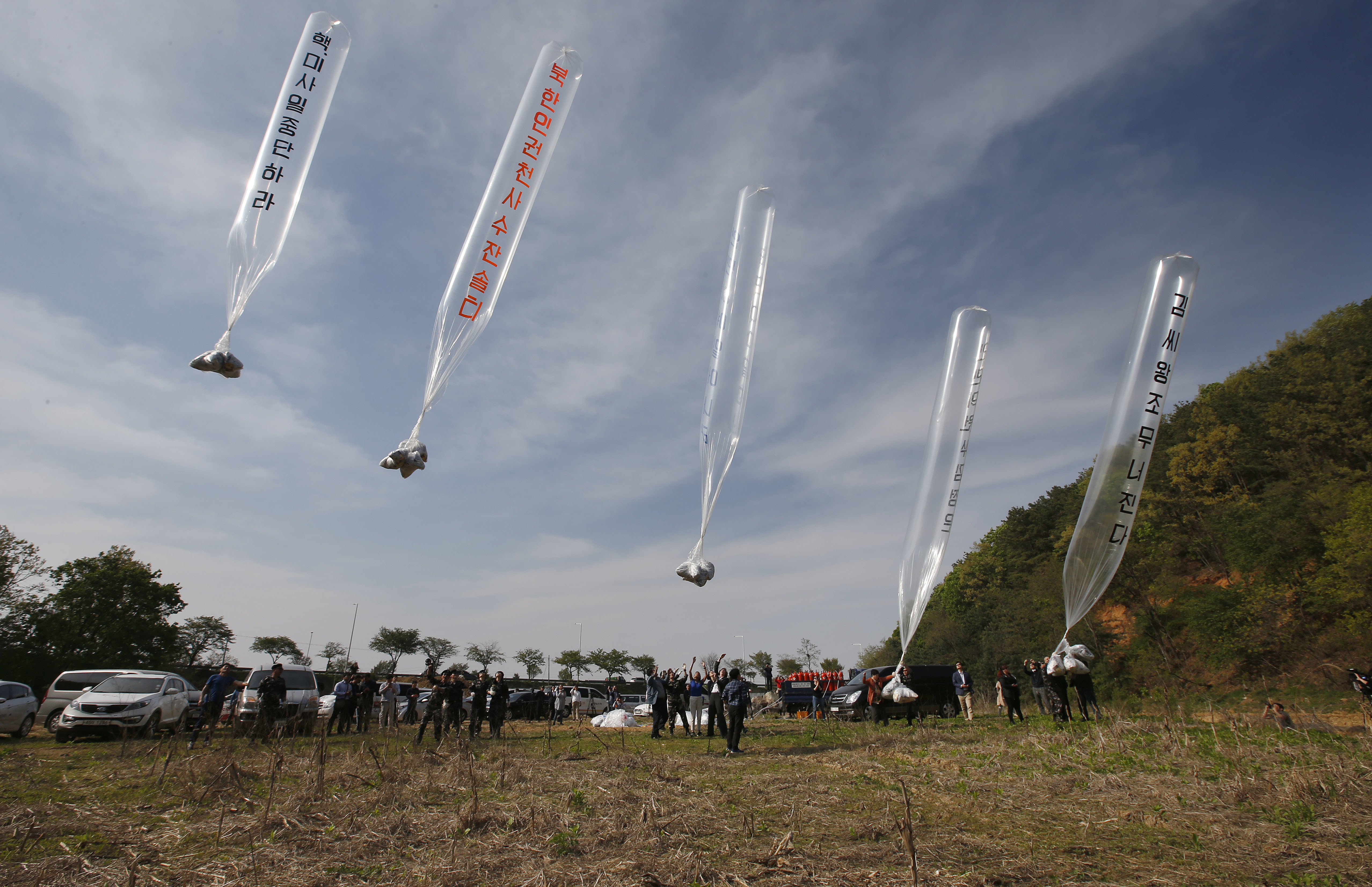 Members of Fighters for Free North Korea, an organisation of defectors from North Korea, send balloons carrying anti-North leaflets across the border from the South Korean border city of Paju