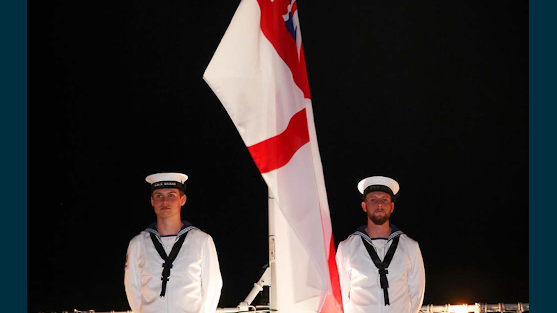 Members of HMS Tamar's ceremonial Sunset Party standby to haul down the ships White Ensign 05082022 CREDIT Royal Navy, MOD