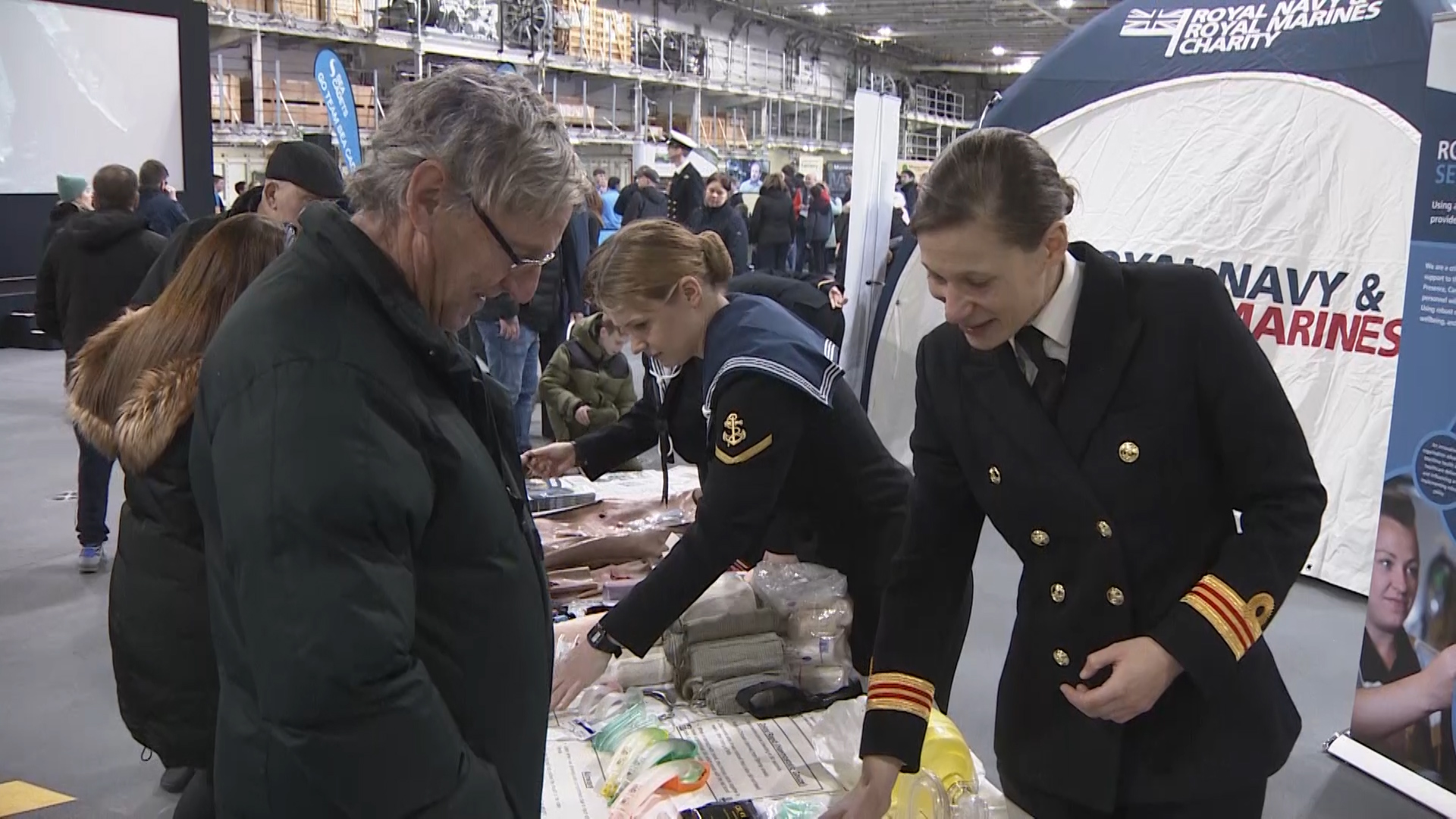 Members of public speak to HMS Prince of Wales sailors on board 290220 CREDIT BFBS