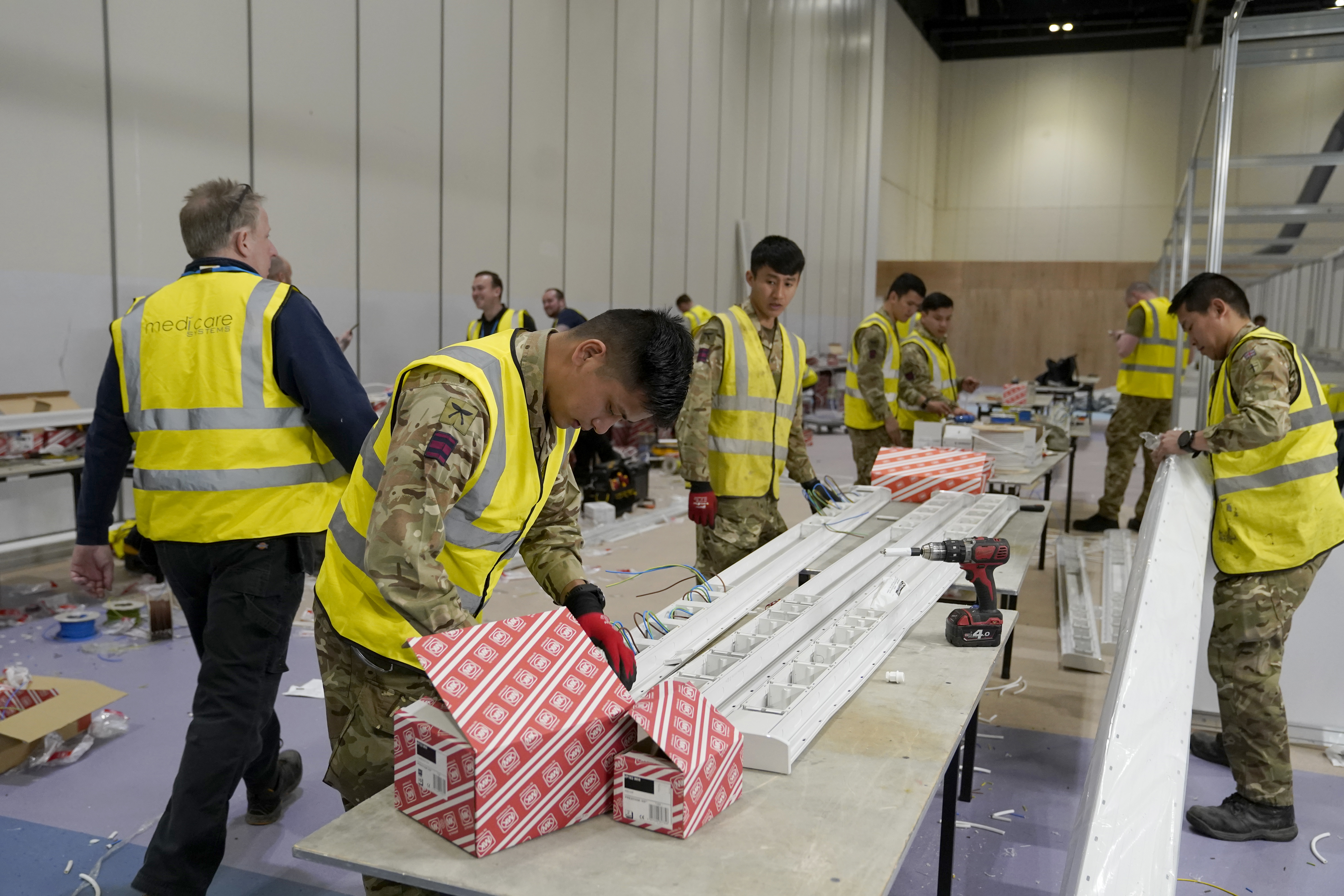 Members of the Queen’s Gurkha Engineer Regiment, 36 Engineer Regiment as they help build Nightingale Hospital