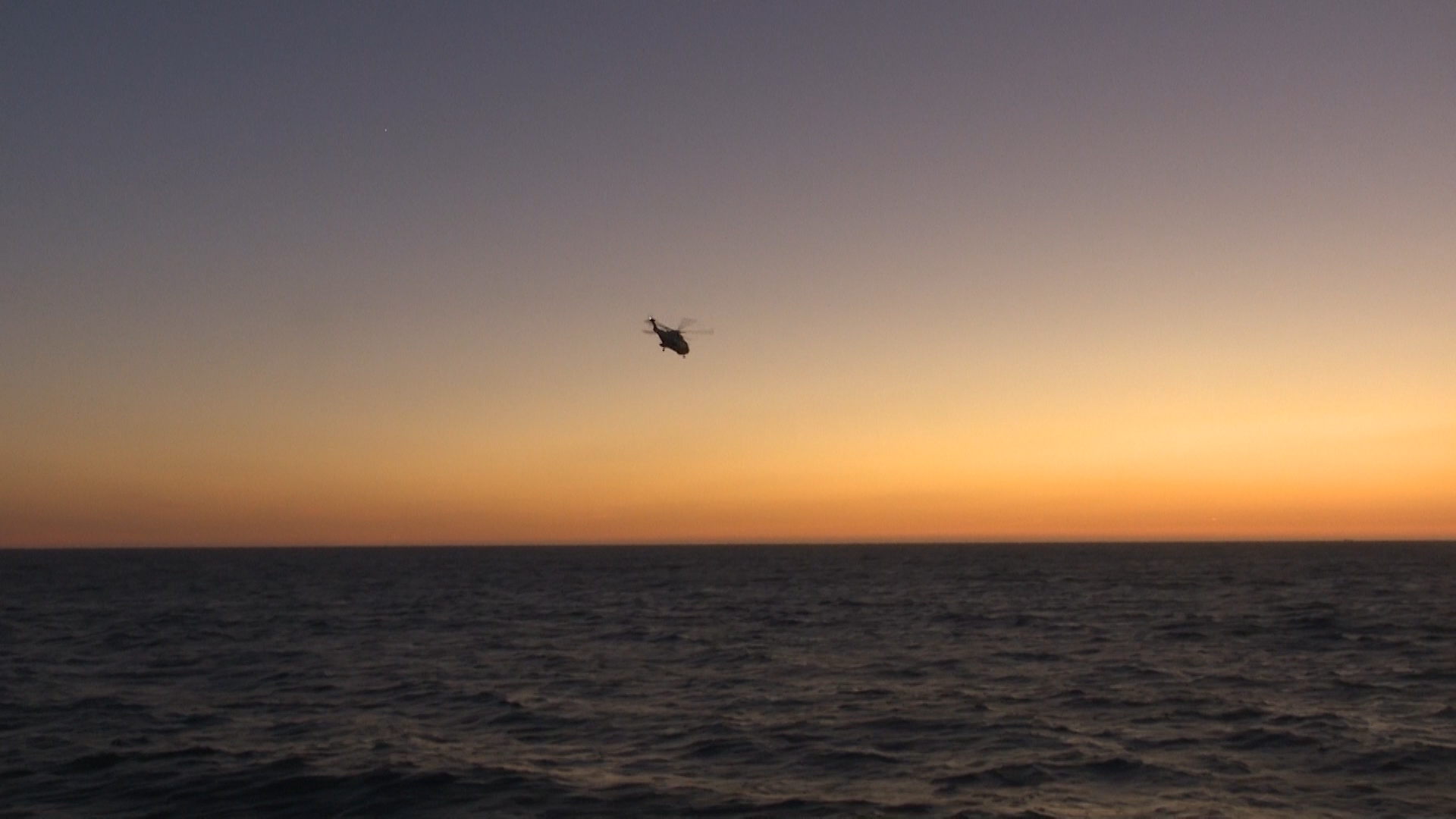 Merlin helicopter heads off at night