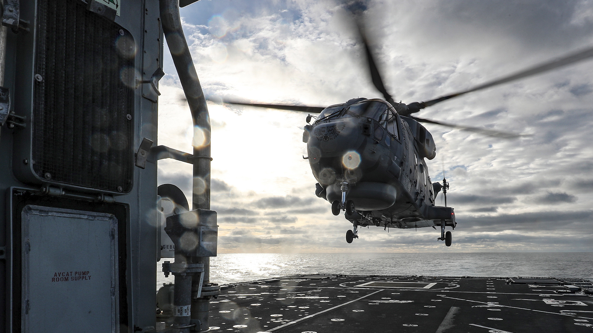 Cover image: The Merlin helicopter lands on HMS Tamar (Picture: MOD).