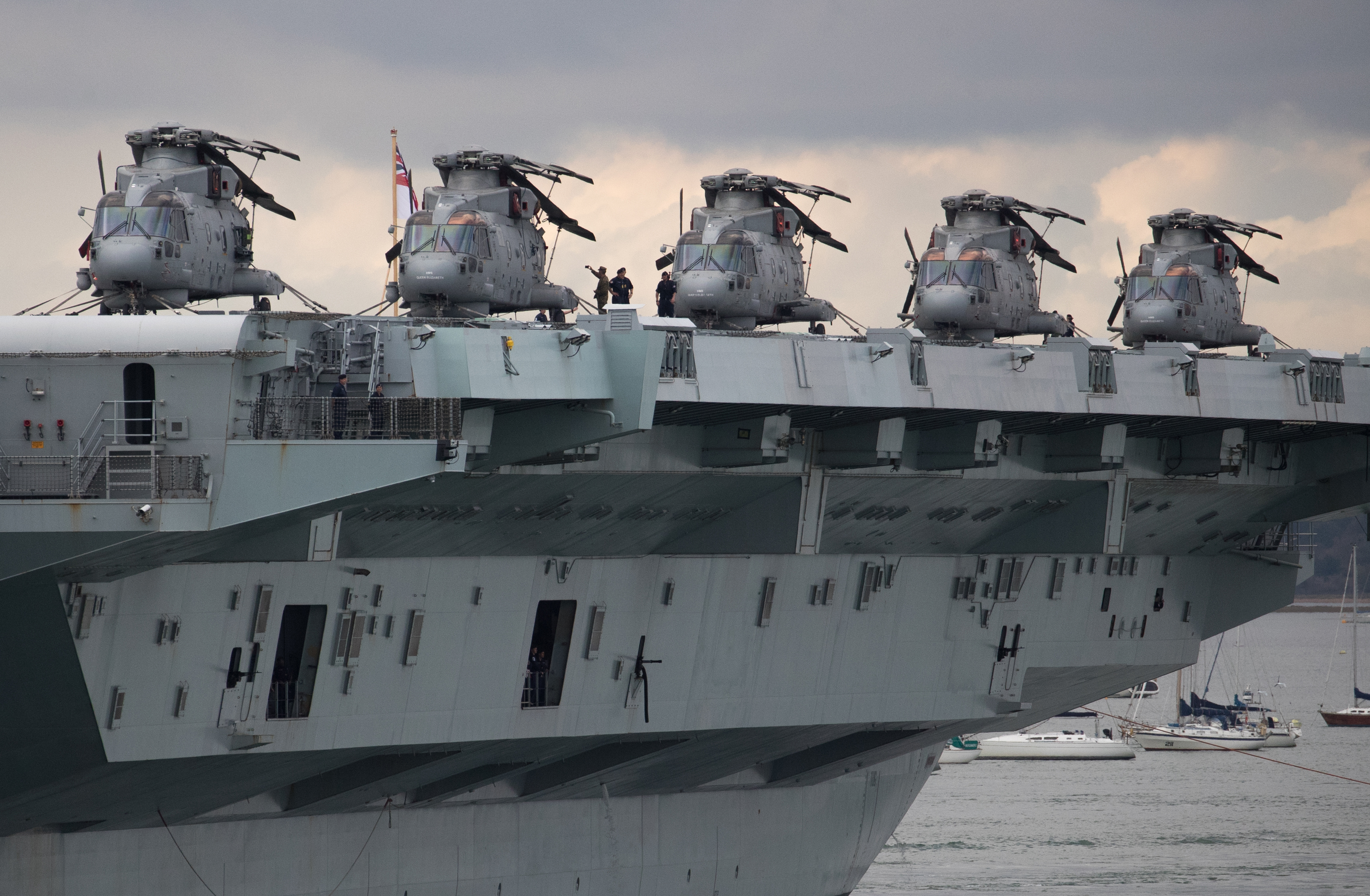 Merlin helicopters on board HMS Queen Elizabeth as she leaves Portsmouth
