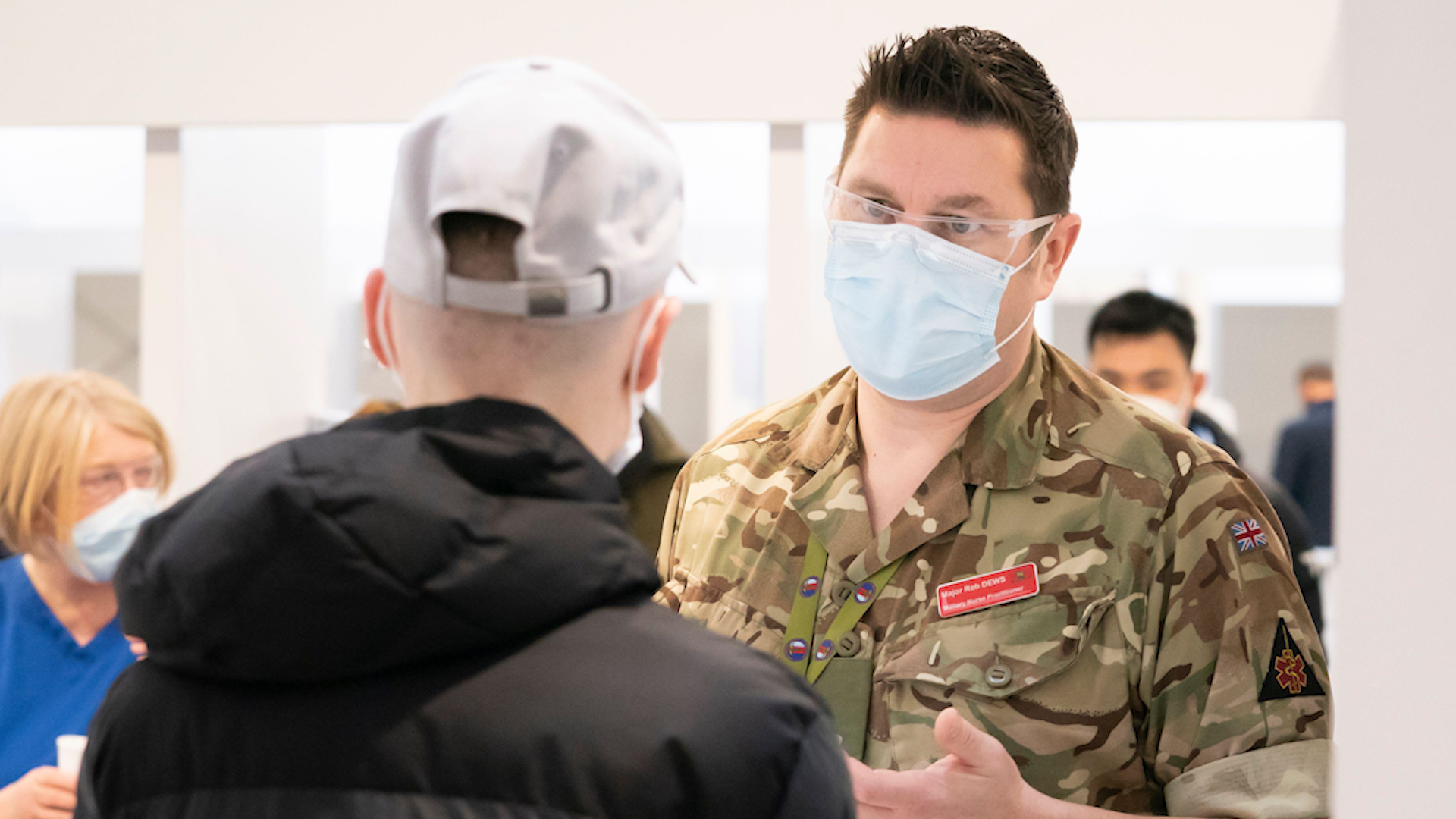 Military nurse practitioner Major Robin Dews helps process people at a vaccination centre at Elland Road in Leeds