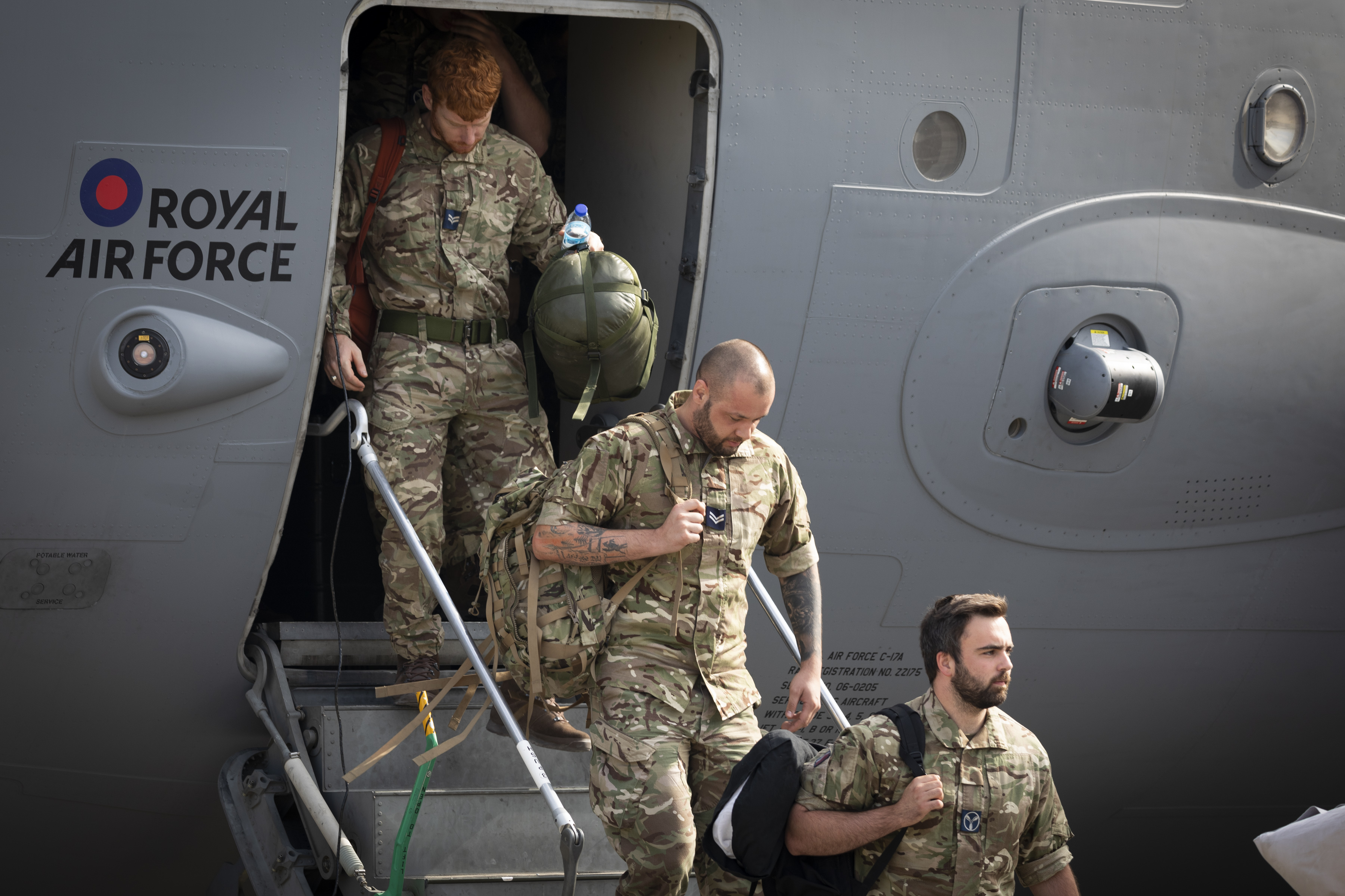 Military personnel departing from a RAF C-17 aircraft after landing at RAF Brize Norton after leaving Afghanistan having helped the UK's evacuation from Kabul airport 290821 CREDIT MOD