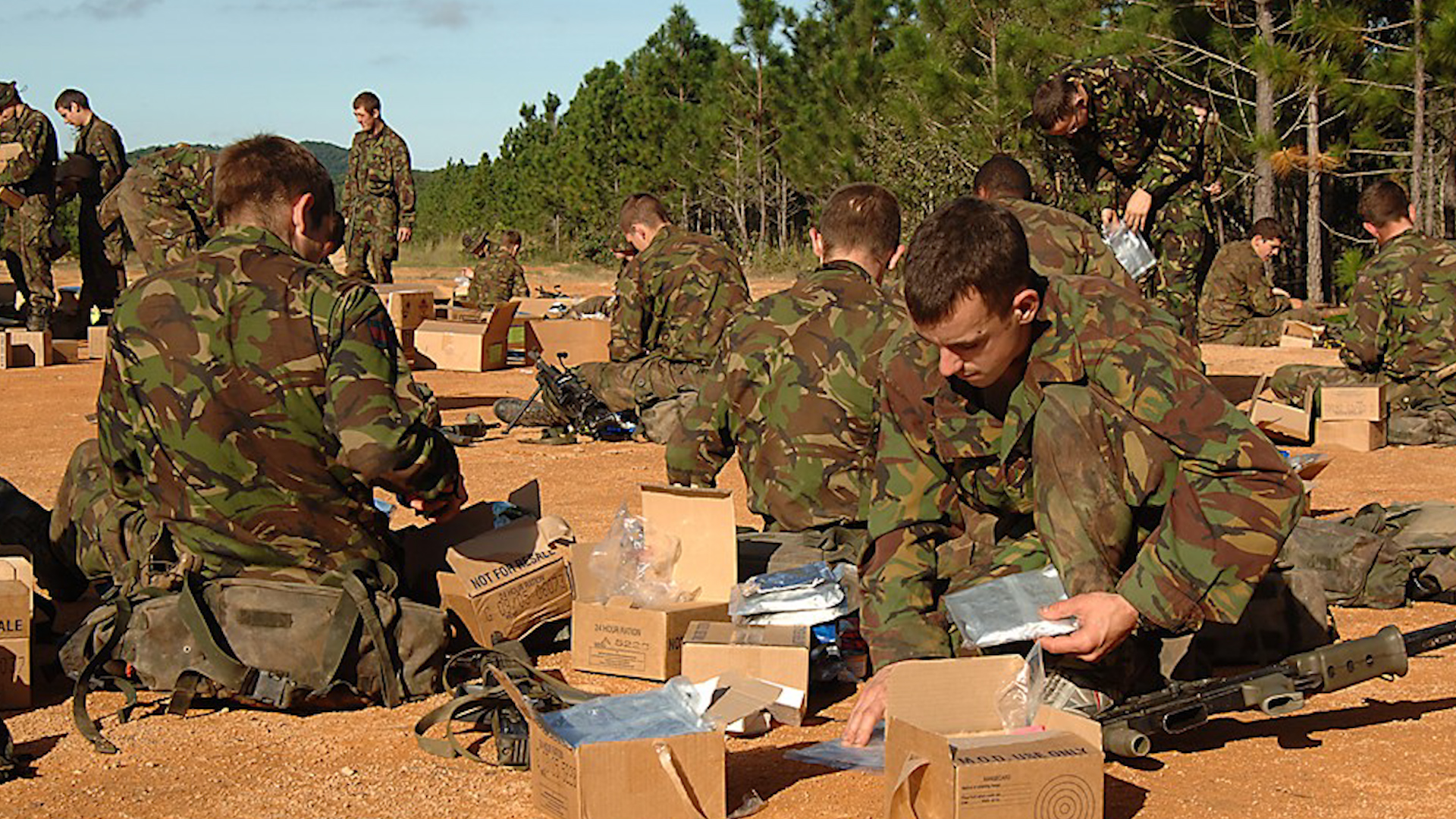 Military ration packs being used by personnel. Unused packs are being donated to FareShare to provide over 170000 meals for those in need