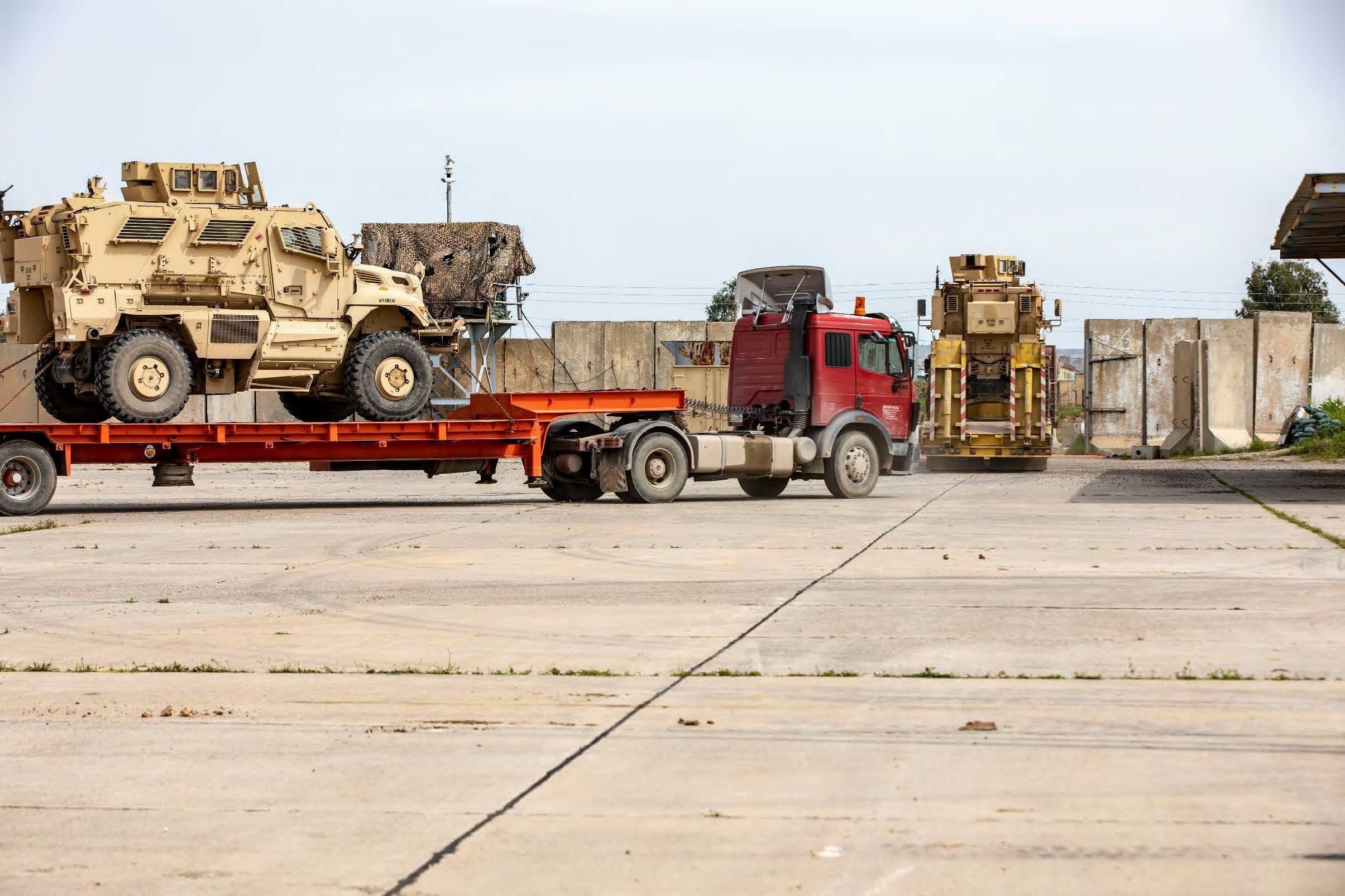 Coalition vehicles are transported out of K1 Air Base ahead of the withdrawal (Picture: US Department of Defense).