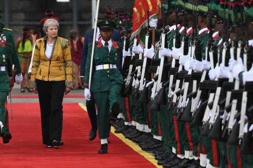 Mrs May being given a military reception in Nigeria (Picture: PA).