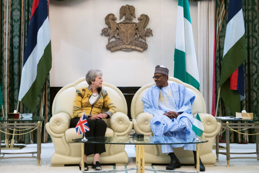 Mrs May with President Buhari at the presidential villa in Abuja (Picture: PA). 