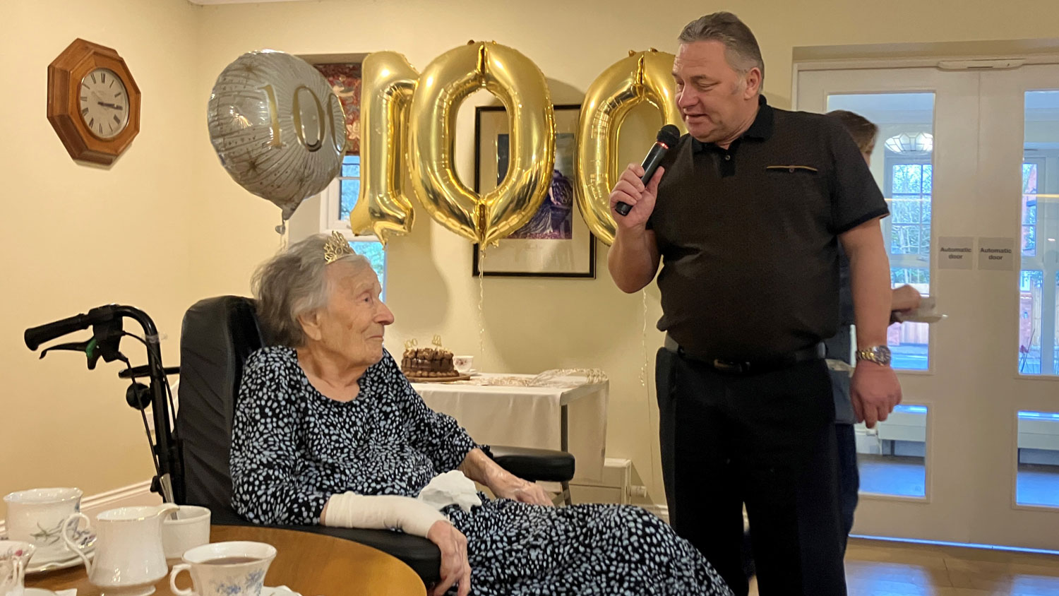 Mrs Amy Wein serenaded by singer Vic Gilder at her 100th birthday party CREDIT Royal Star & Garter
