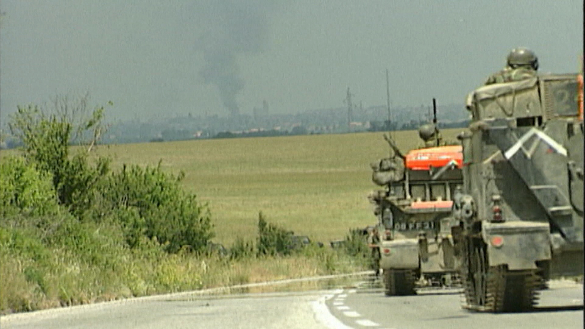 NATO troops roll into Kosovo.