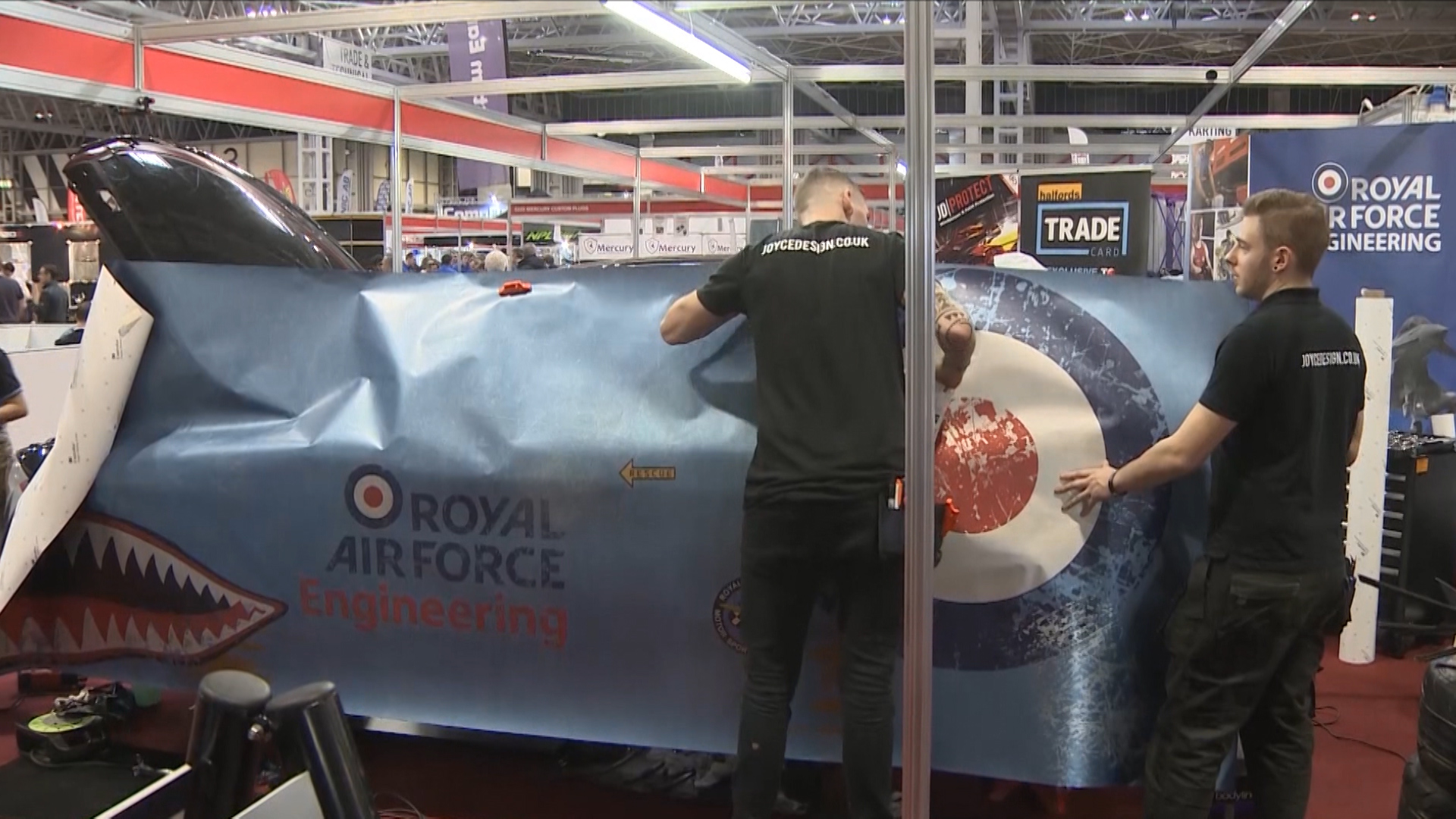 An RAF team transform a road car for racing at the Auto Sport Show in Birmingham