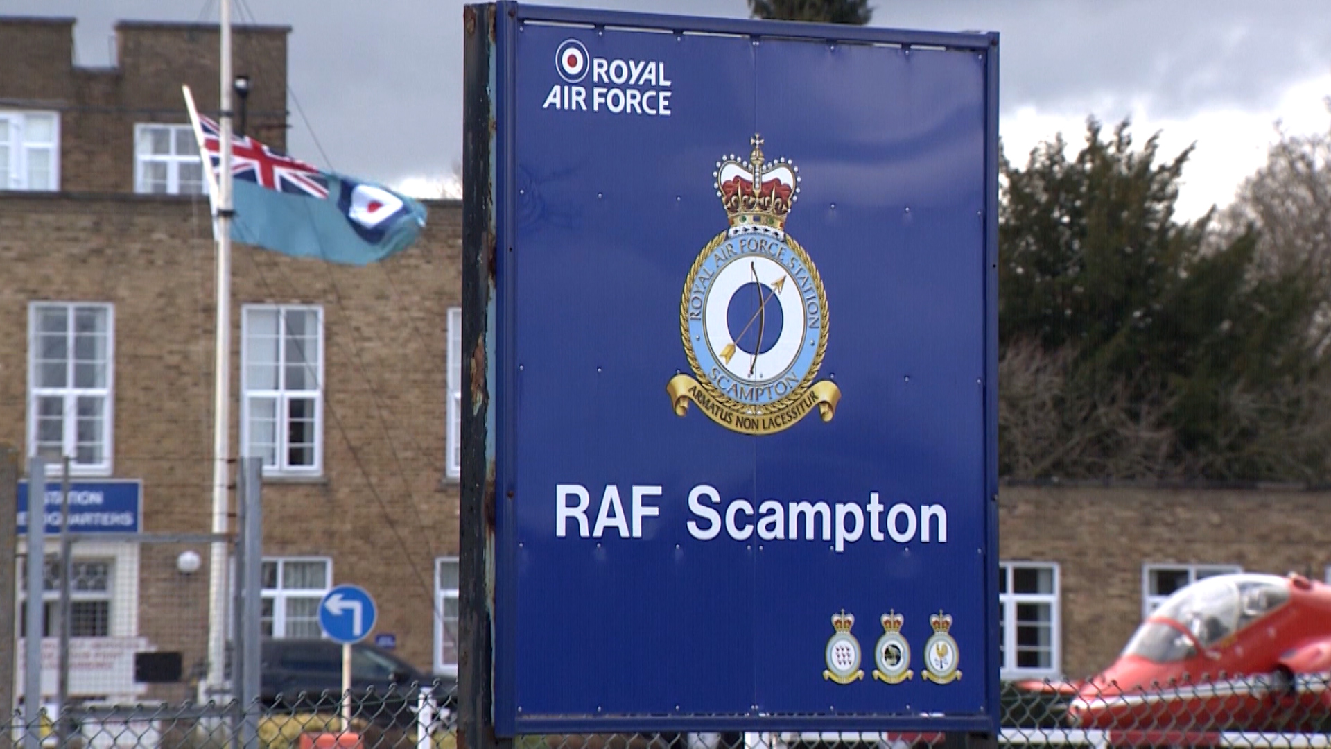 RAF Scampton entrance sign with Red Arrows Hawk