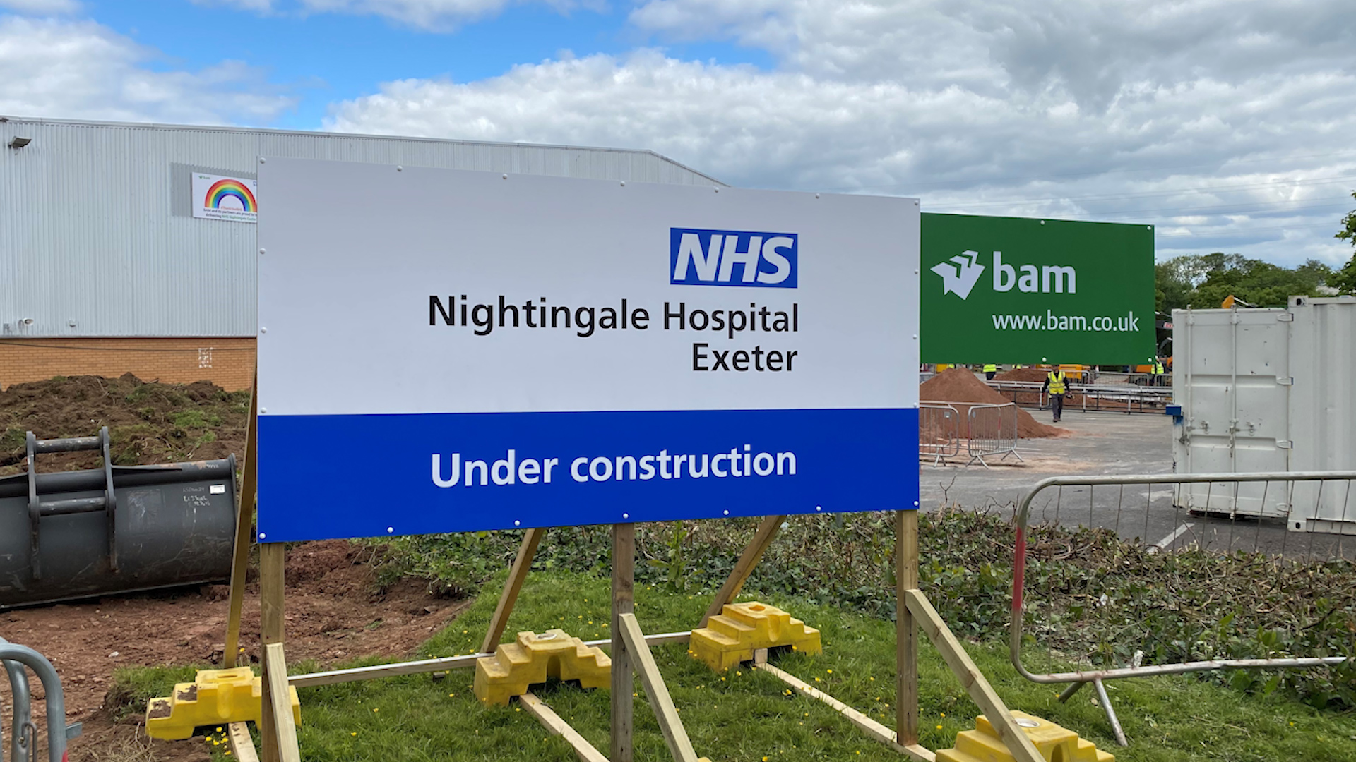 NHS Nightingale Hospital Exeter under construction sign.