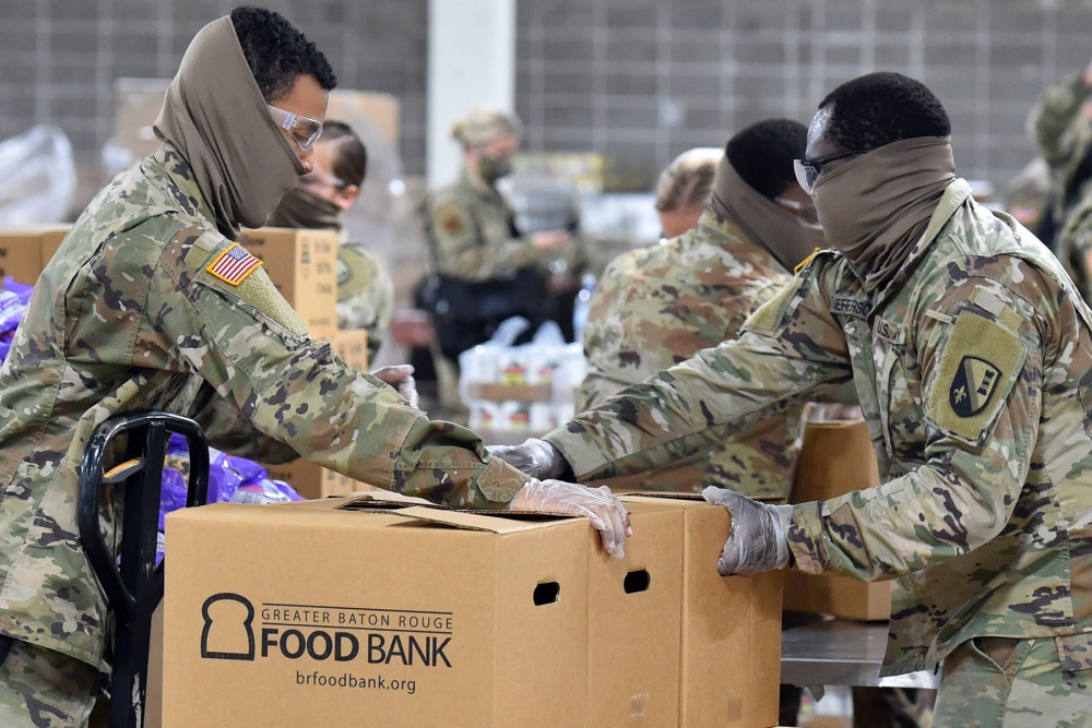 National Guard members in the US prepare food boxes as part of COVID support efforts in Louisiana (Picture: US Department of Defense).