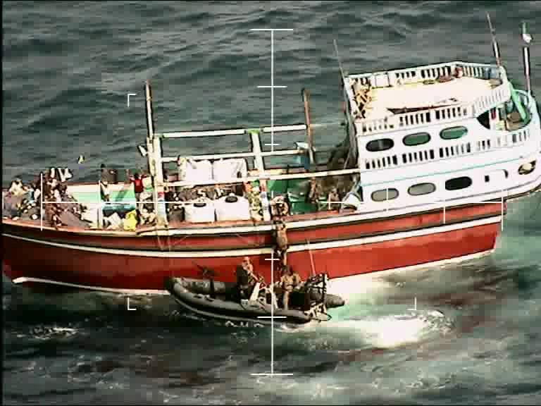 Navy personnel boarding a suspicious vessel in the Arabian Sea which was found to have 450kg of drugs hidden onboard