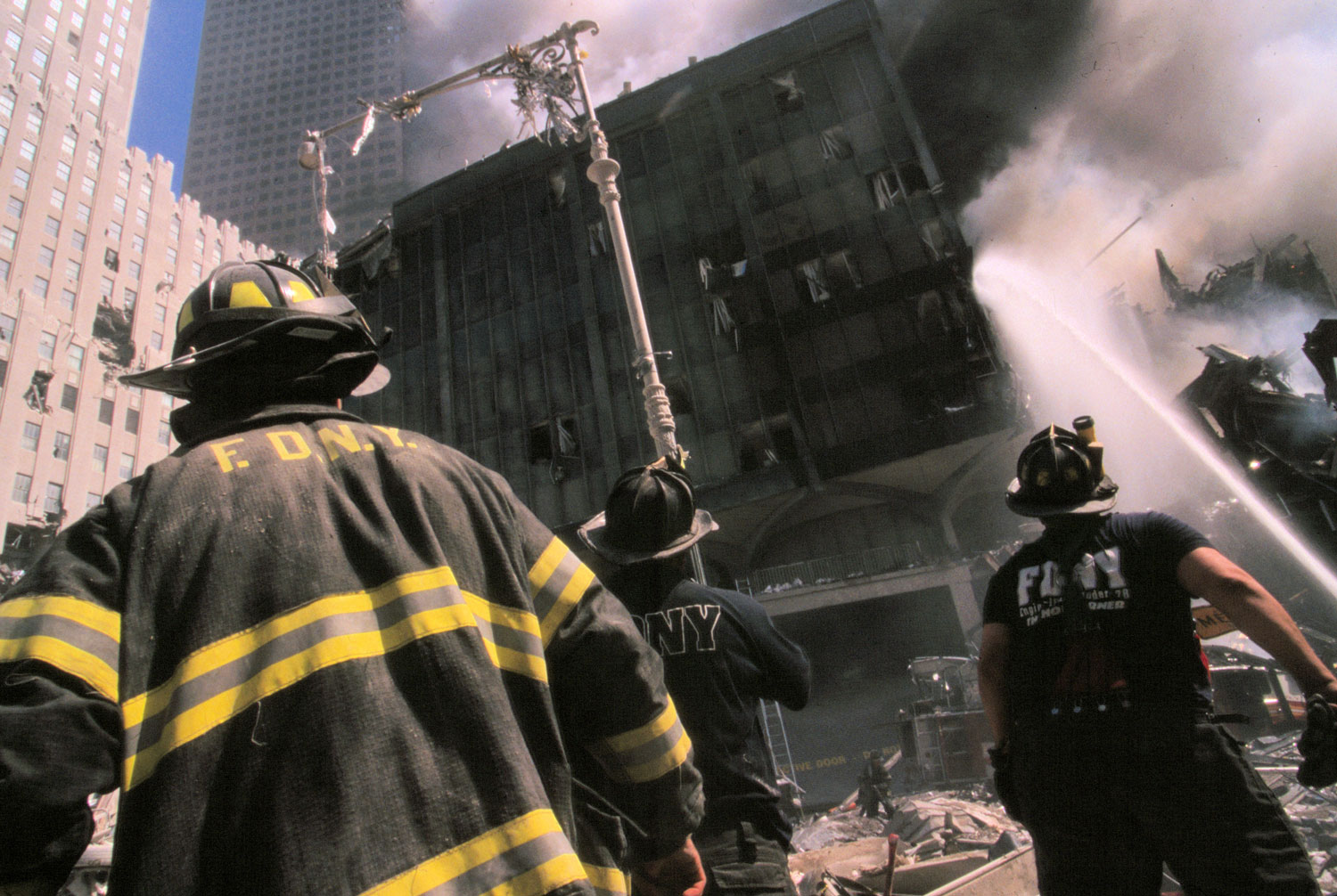New York firefighters burning building September 11