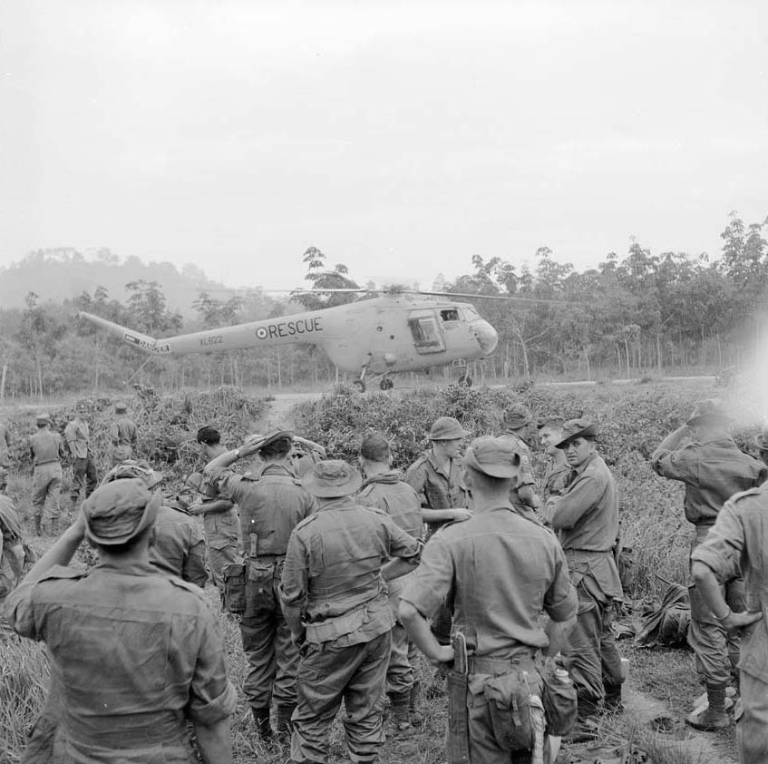 New Zealand Special Air Service (SAS) soldiers with a Bristol Sycamore helicopter of the Royal Air Force. Photograph taken by a New Zealand Army photographer during the Malayan Emergency (1948-1960) Alexander Turnbull Library, Wellington, New Zealand.