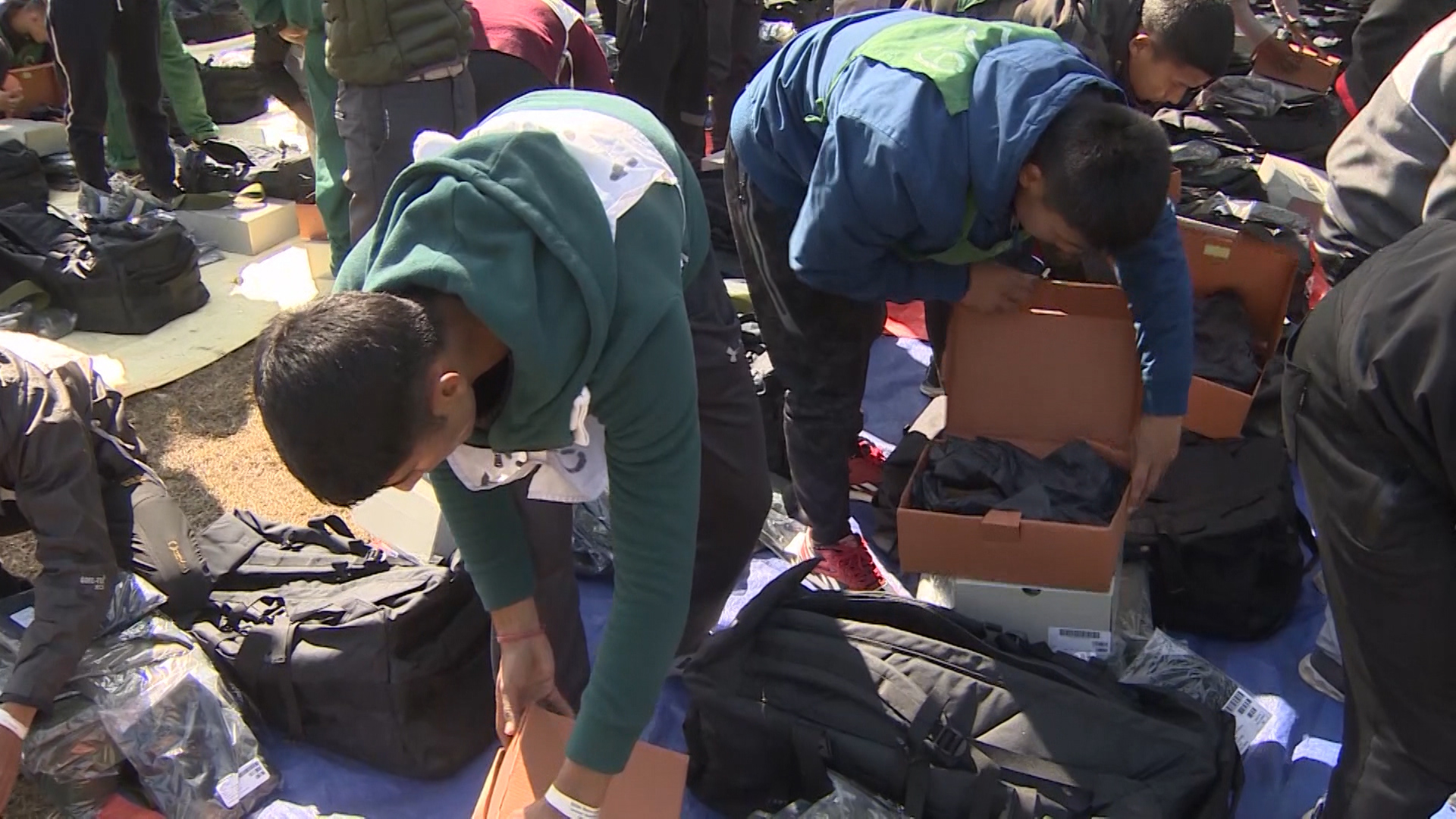 New recruits unpack their new uniform and clothes