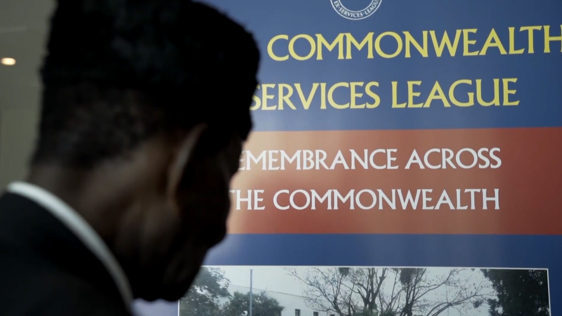 Black Veteran with Commonwealth Ex-Services League sign