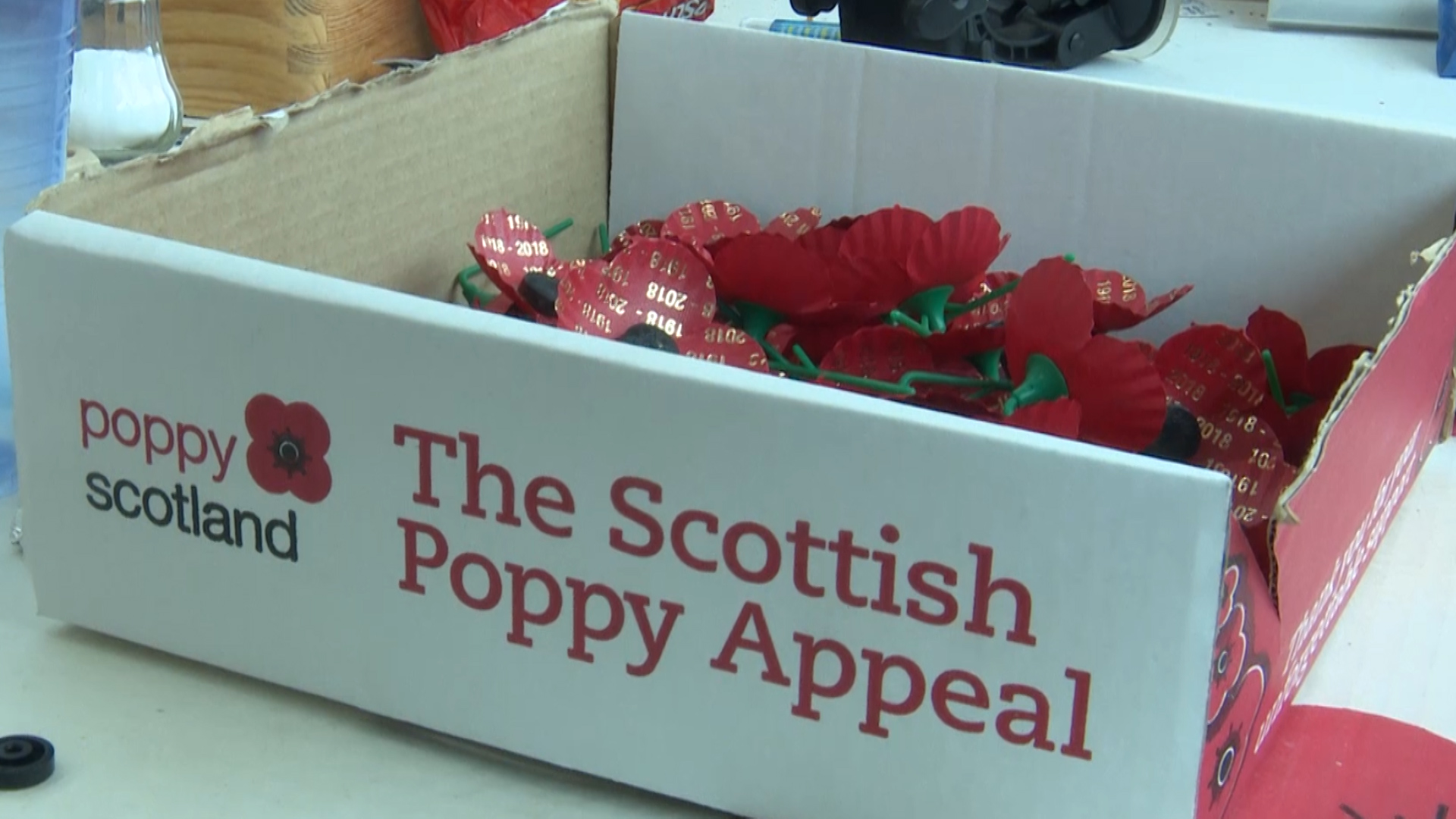 Box of commemorative WW1 Scottish poppies