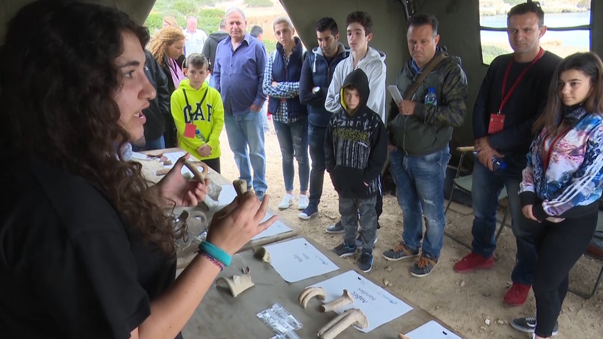 Archaeologist with locals and artifacts from site of ancient Roman port at RAF Akrotiri in Cyprus