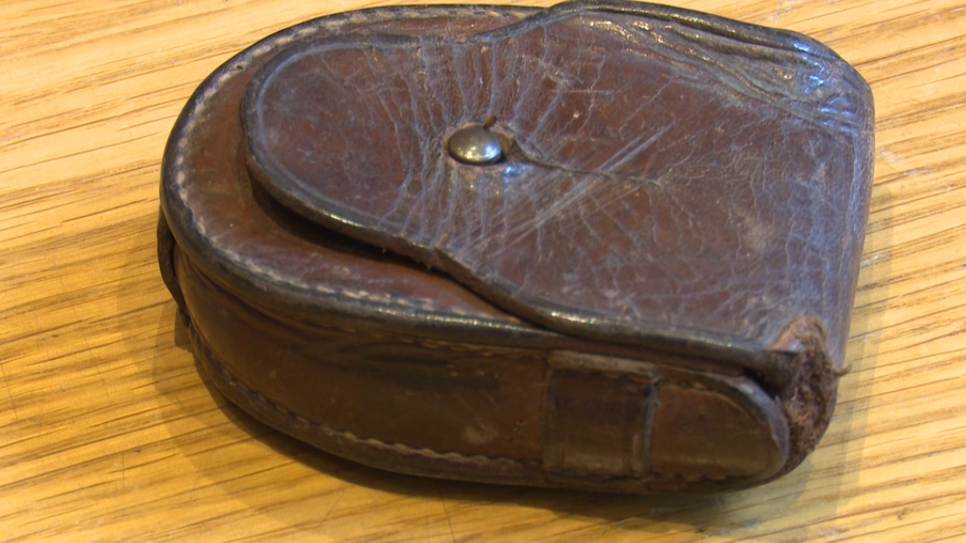 Leather compass case of Sydney Day VC with bullet mark