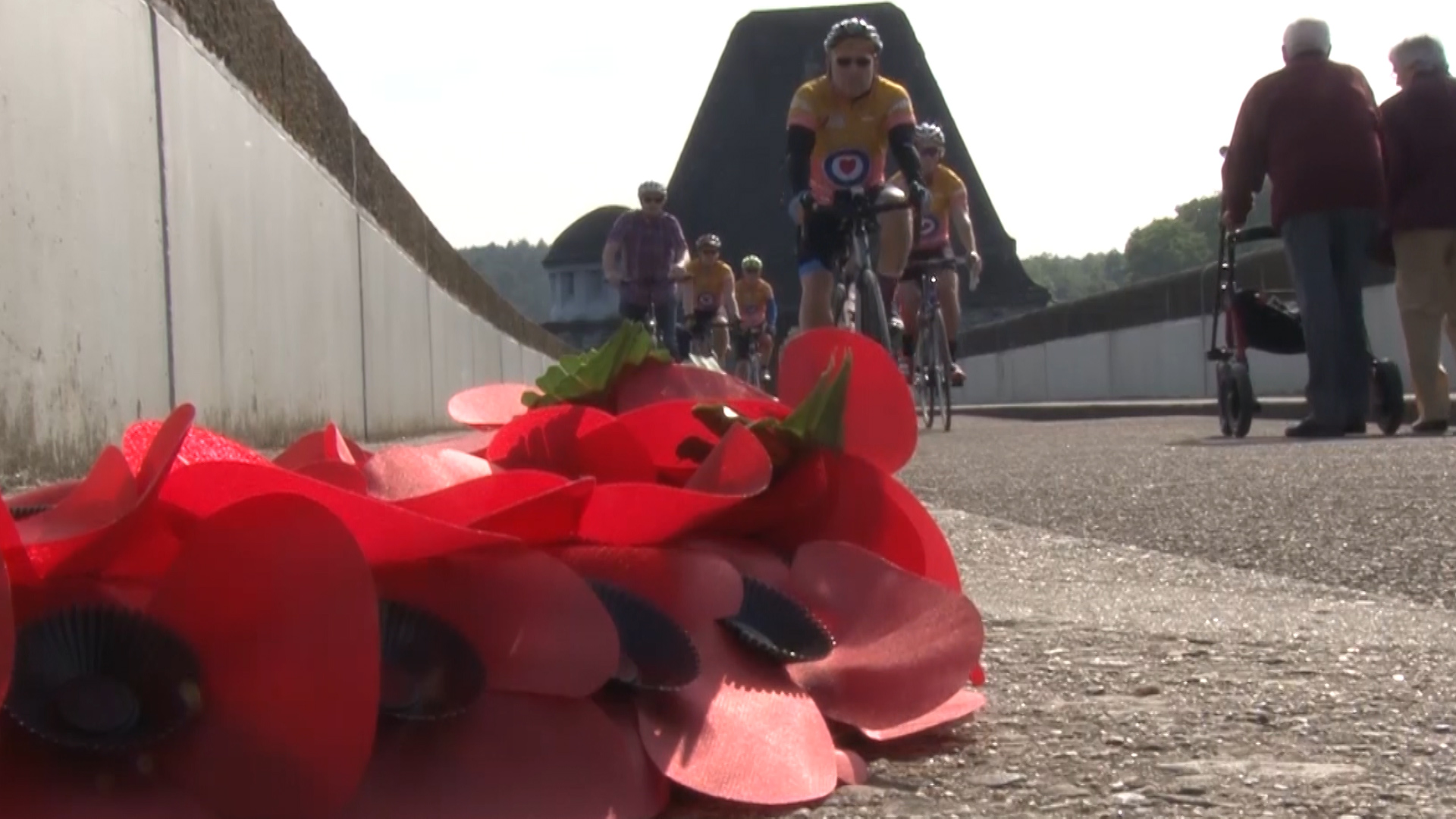Charity cyclists ride over Moehne dam during Dambusters commemorations 
