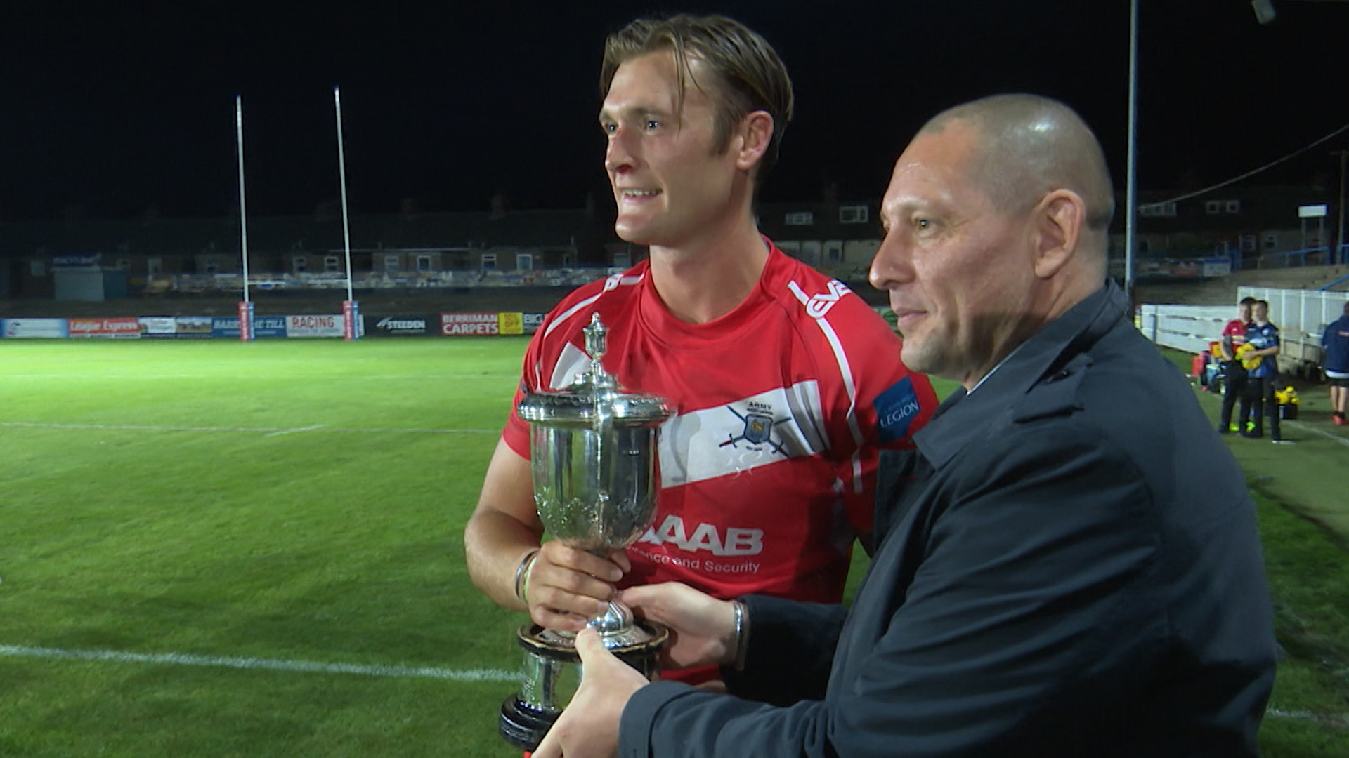 Army captain Staff Sergeant Jordon Kerman collects Rugby League Trophy