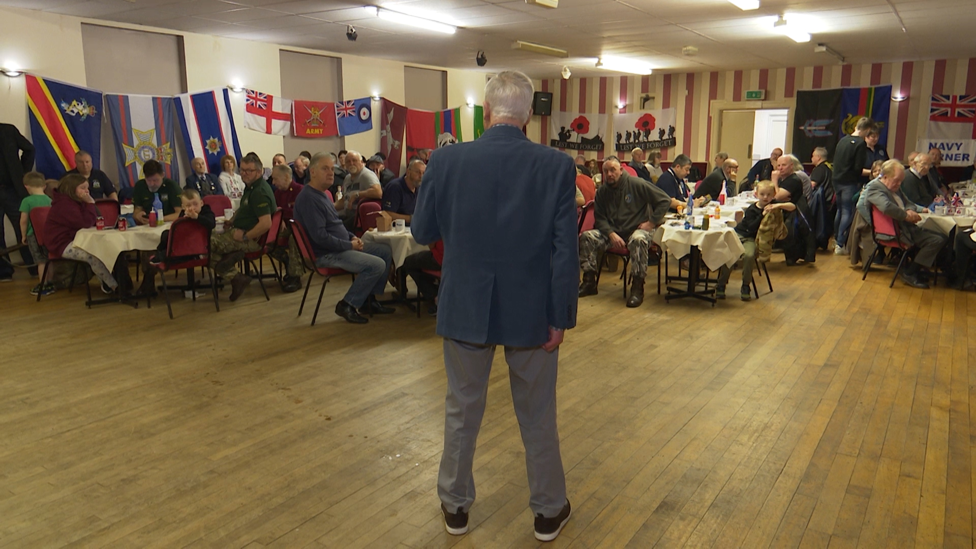 WWII RAF Veteran Frank Tolley reads a poem to the veterans club.